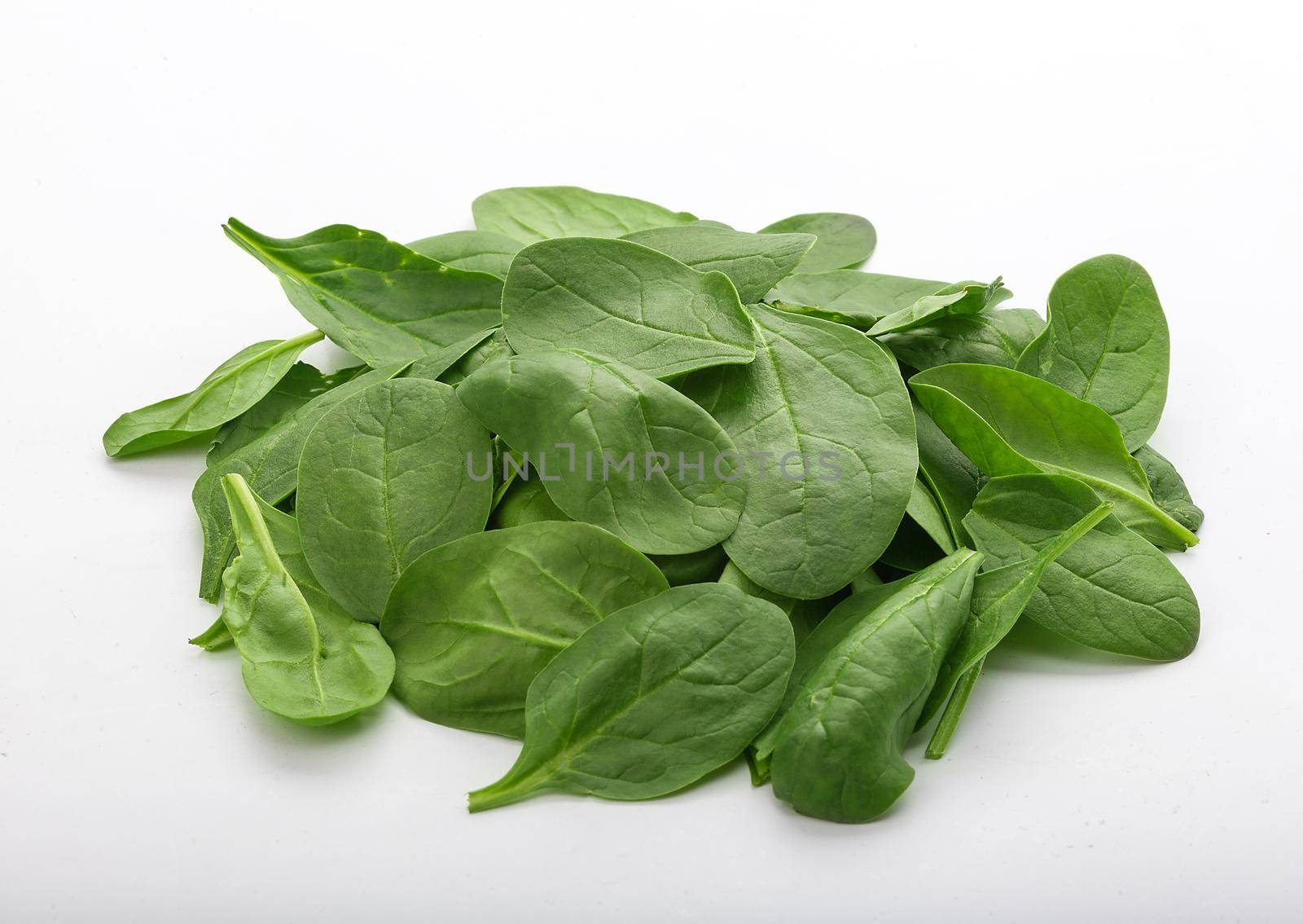 Fresh green spinach in the white by Angorius