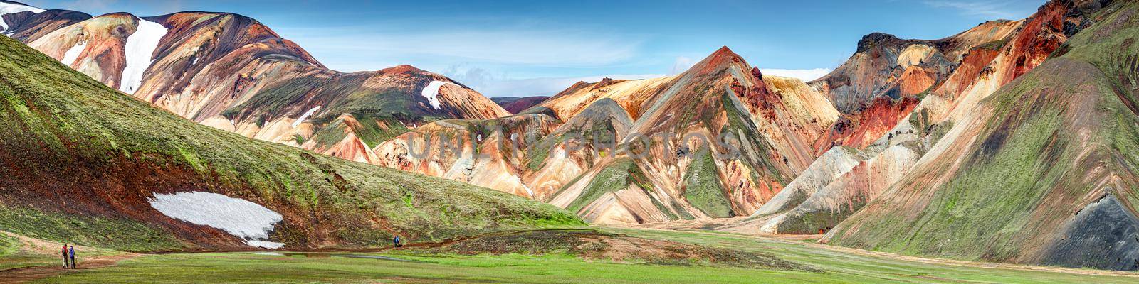Panoramic true Icelandic rough landscape view of colorful rainbow volcanic Landmannalaugar mountains, volcanoes, streams and famous Laugavegur hiking trail, Iceland, summer