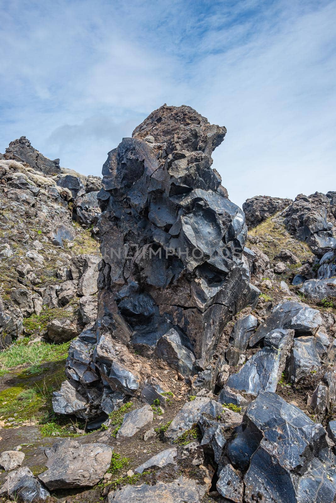 Volcanic glass rock known as obsidian found in lava fields formed by polymerized magma during volcanic eruption in rhyolitic silica, Iceland, details