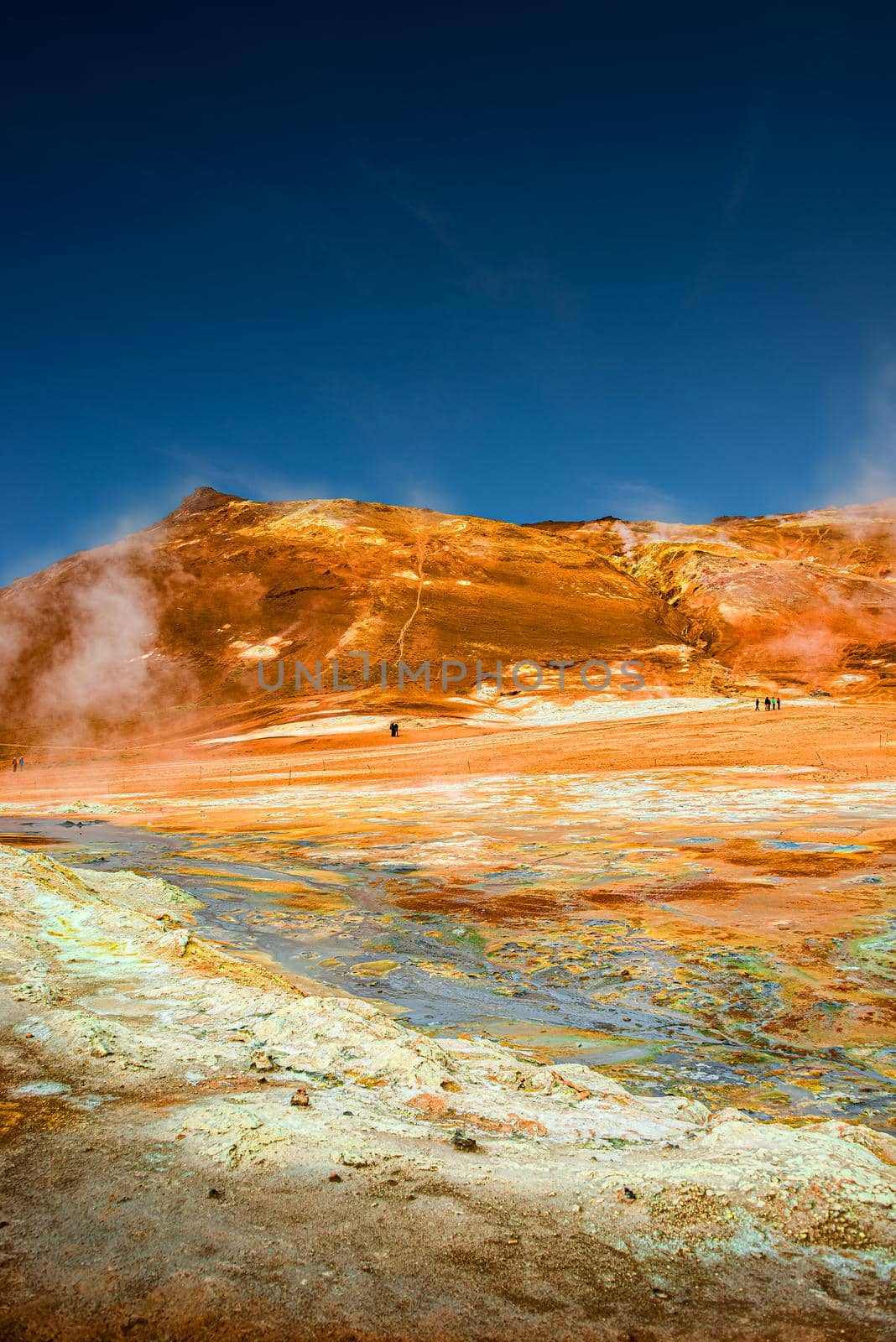 Martian landscape at Hverir geothermal active zone near Myvatn lake in Iceland at blue deep sky