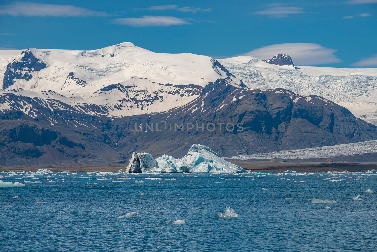View of Glacier Lagoon Jokulsarlon with icebergs and Vatnajokull Glacier tongue, Iceland