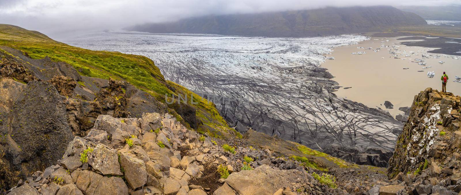 Panoramic view over Skaftafellsjokull glacier and tourists, a wander near Skaftafell on South Iceland