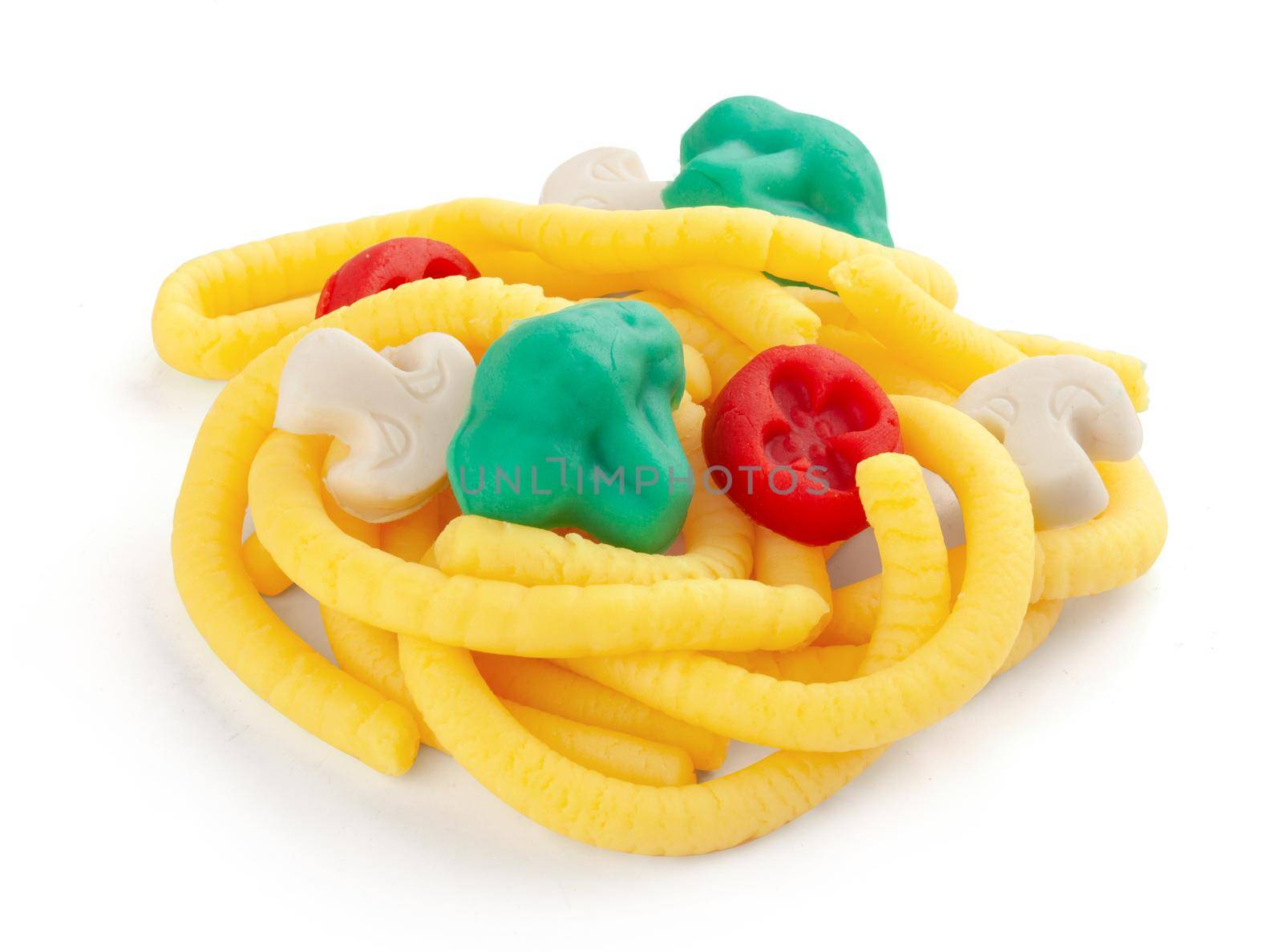 Isolated plasticine pasta with vegetables on the white