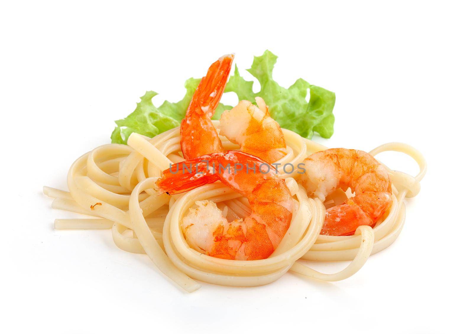 Handful of fried shrimps with pasta and fresh lettuce
