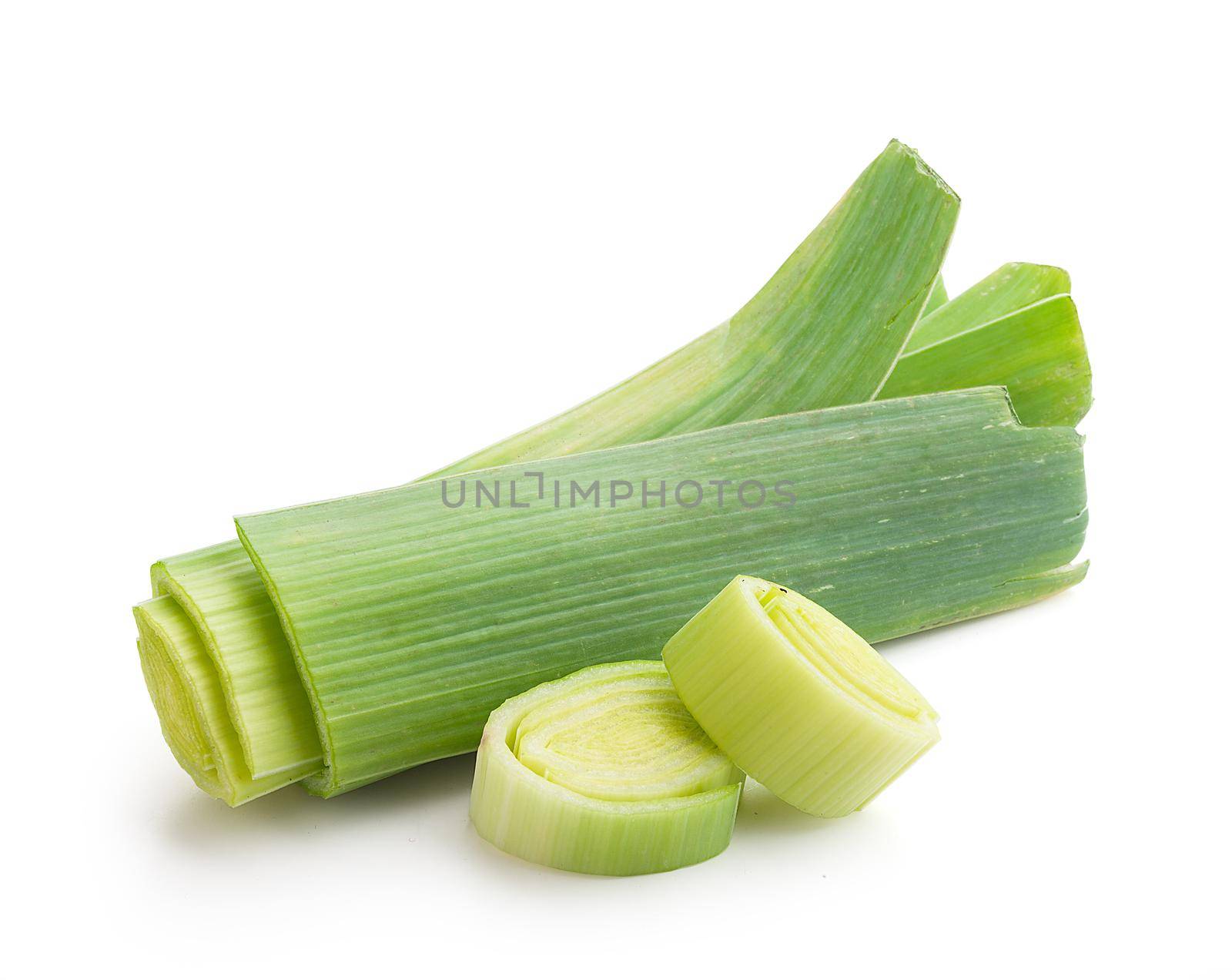 Isolated pieces of fresh green leek on the white background