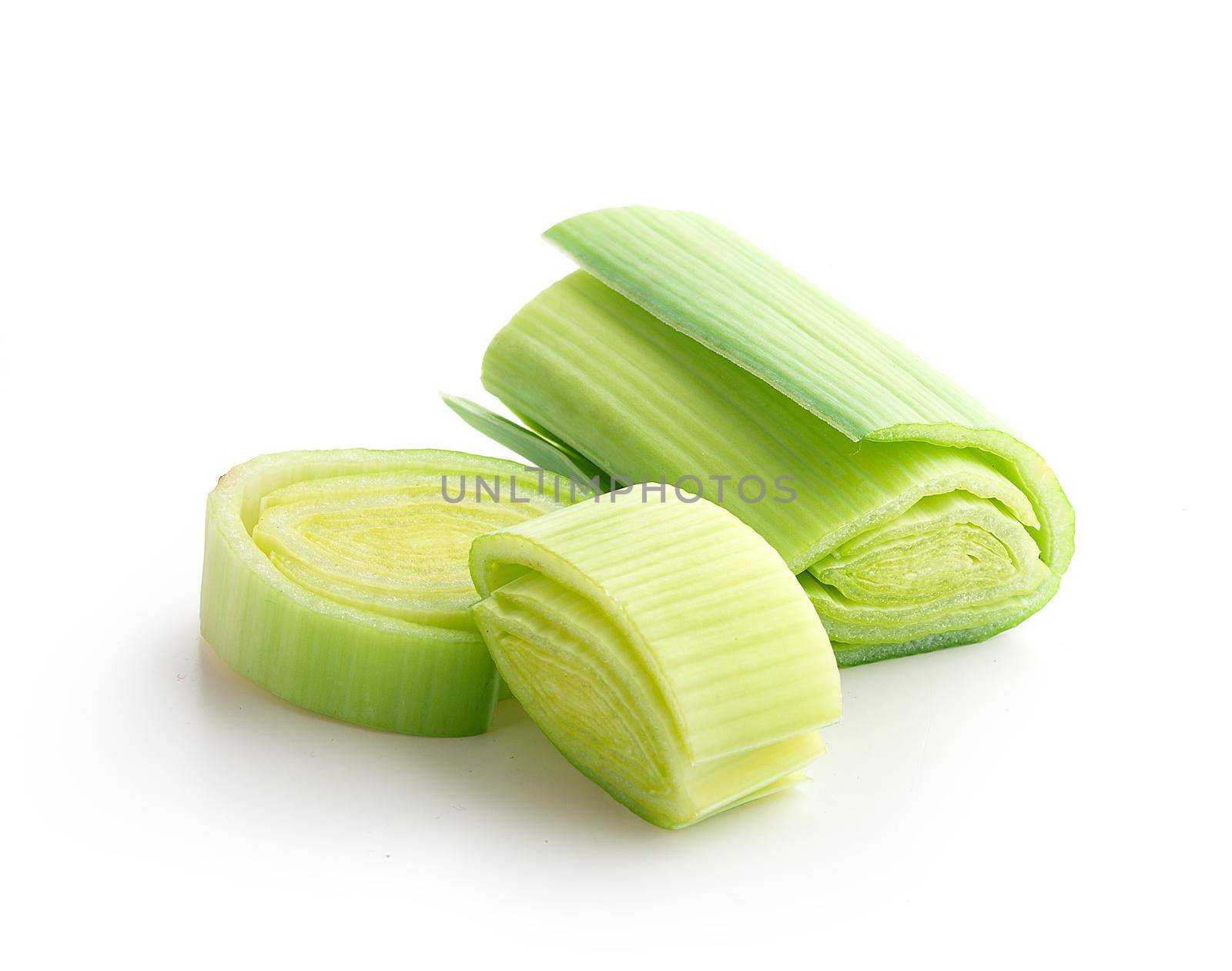 Isolated pieces of fresh green leek on the white background