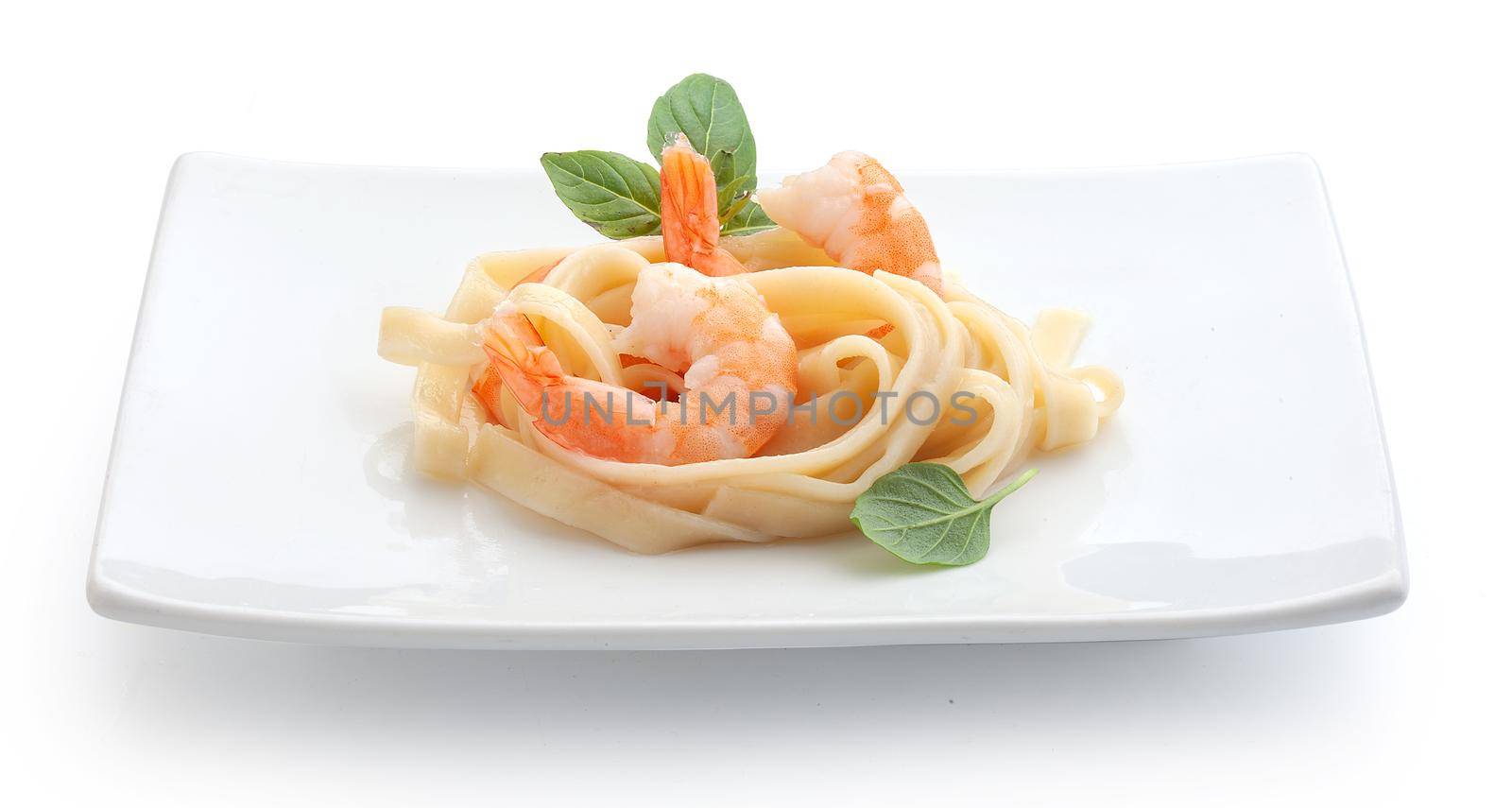 Boiled shrimps with pasta on the plate