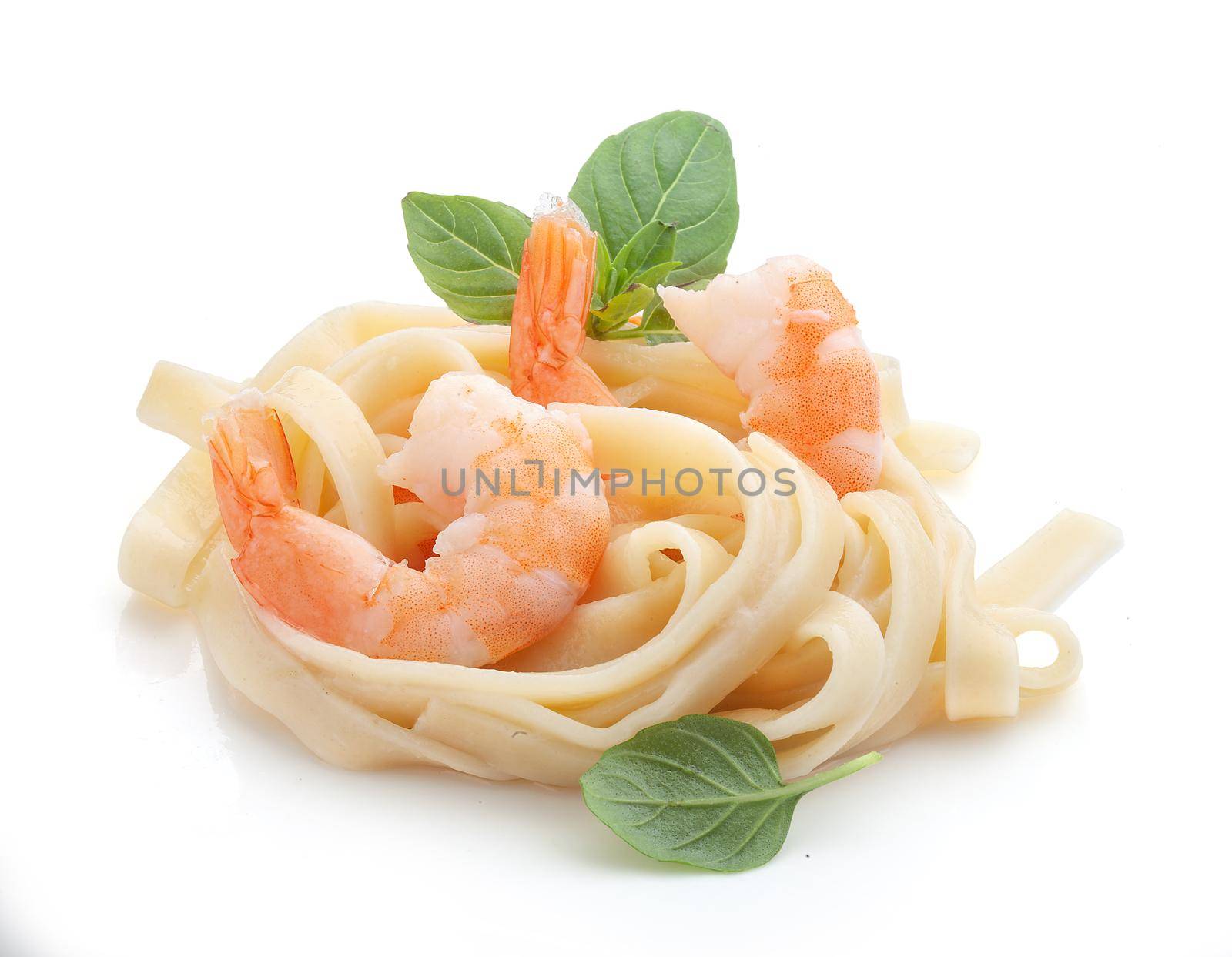 Boiled shrimps with pasta on the plate