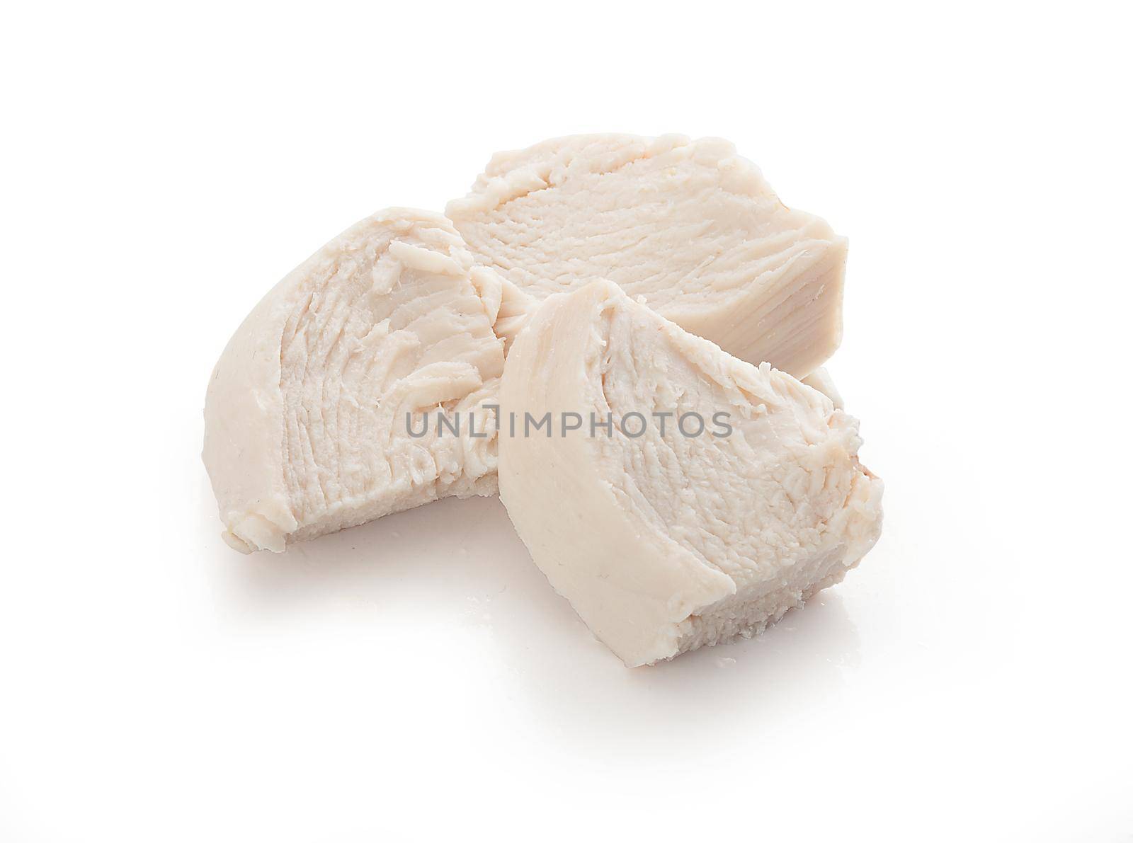 Isolated handfull of prepared chicken pieces on the white background