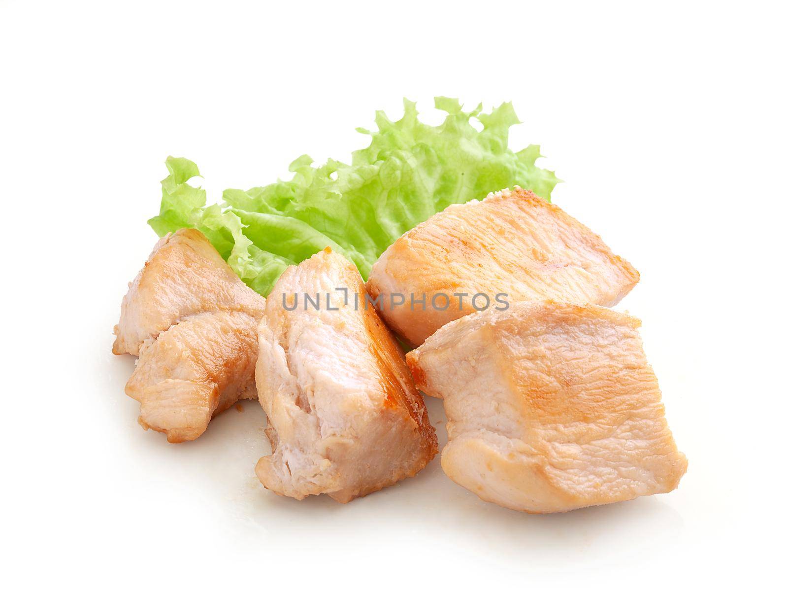 Fried chicken pieces with fresh green lettuce