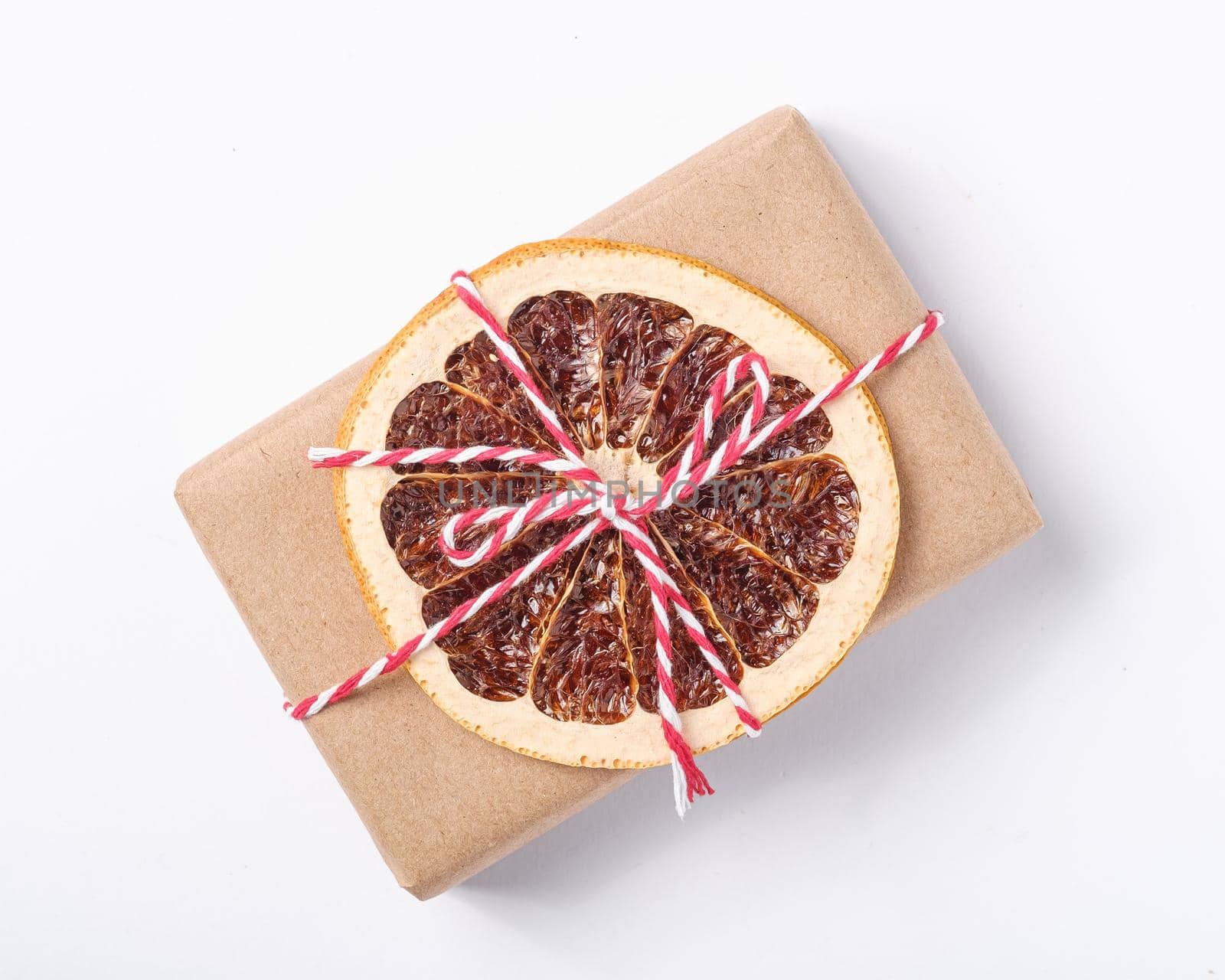 Christmas holidays zero waste paper giftbox wrapping with dried fruit