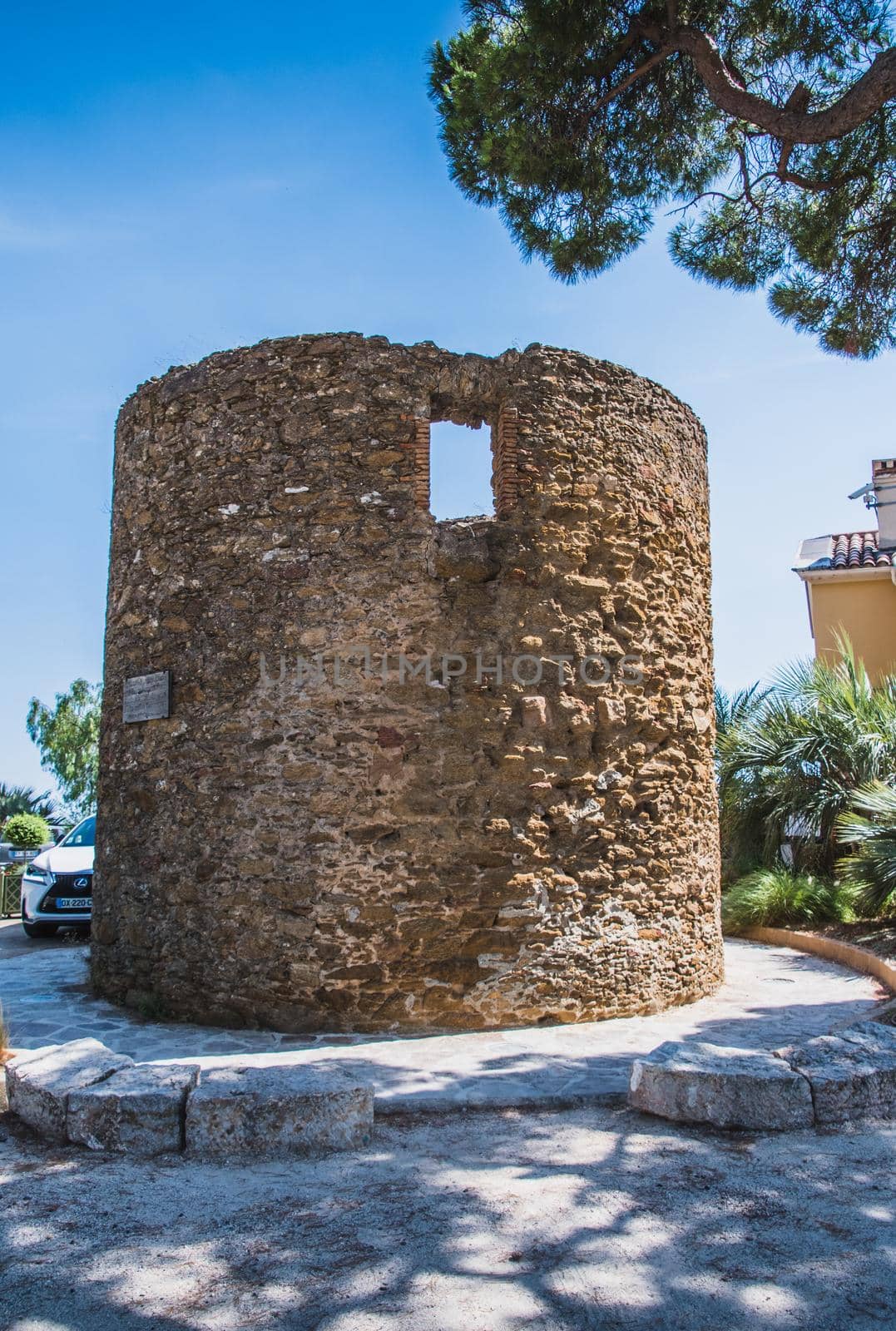 Old windmill Bormes-les-Mimosas typical village in the south of France