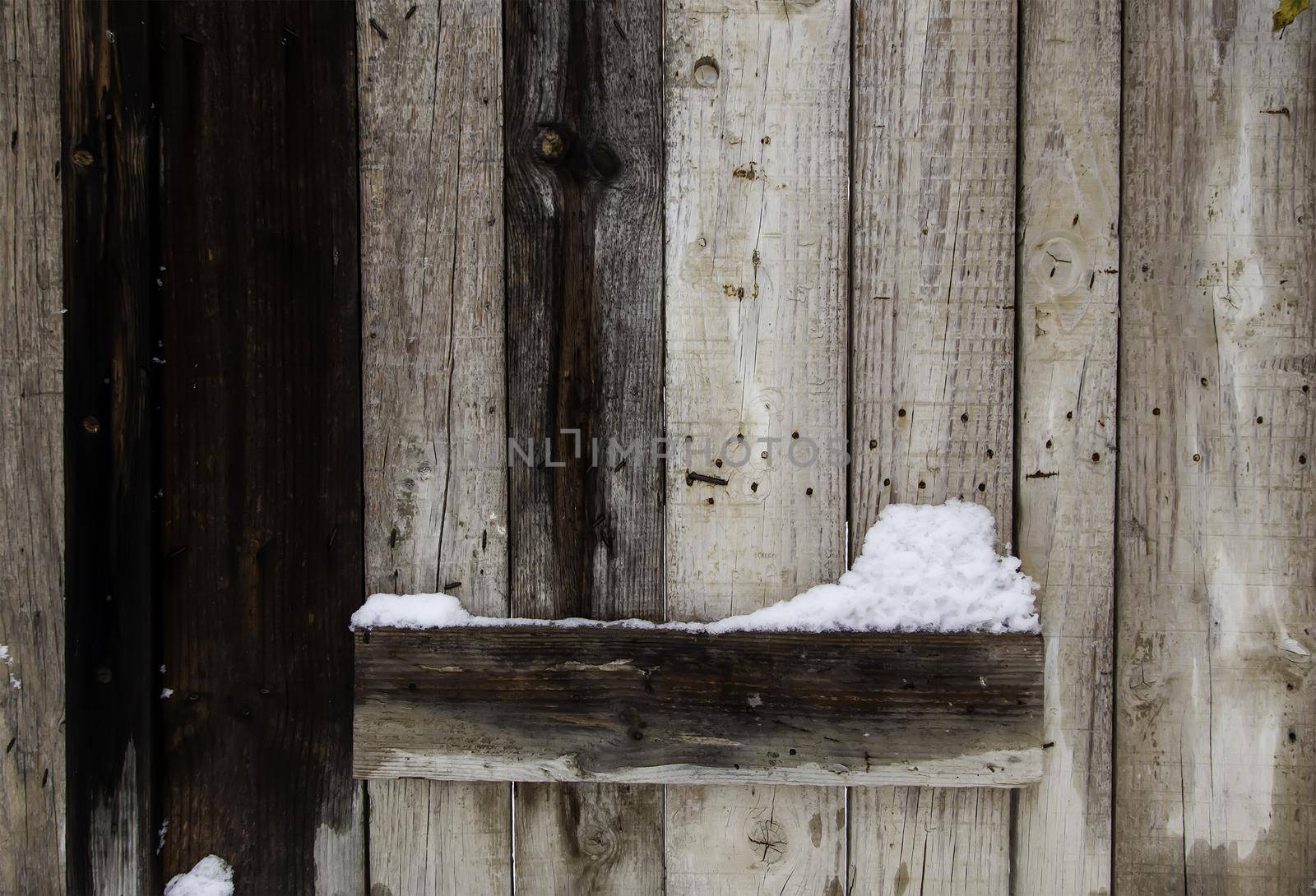 Wood detail on a snow-stained winter day