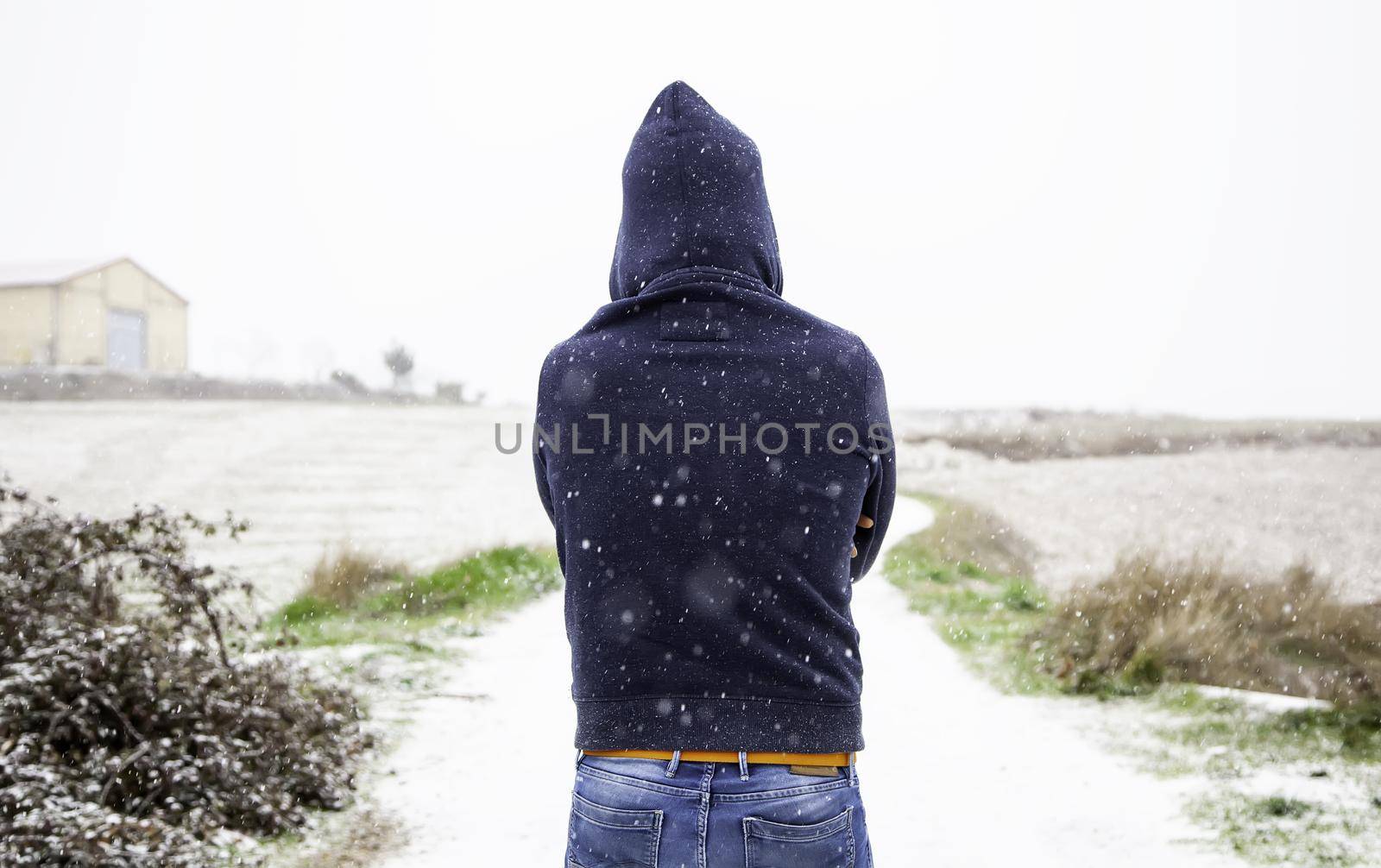 Young man under the snow by esebene