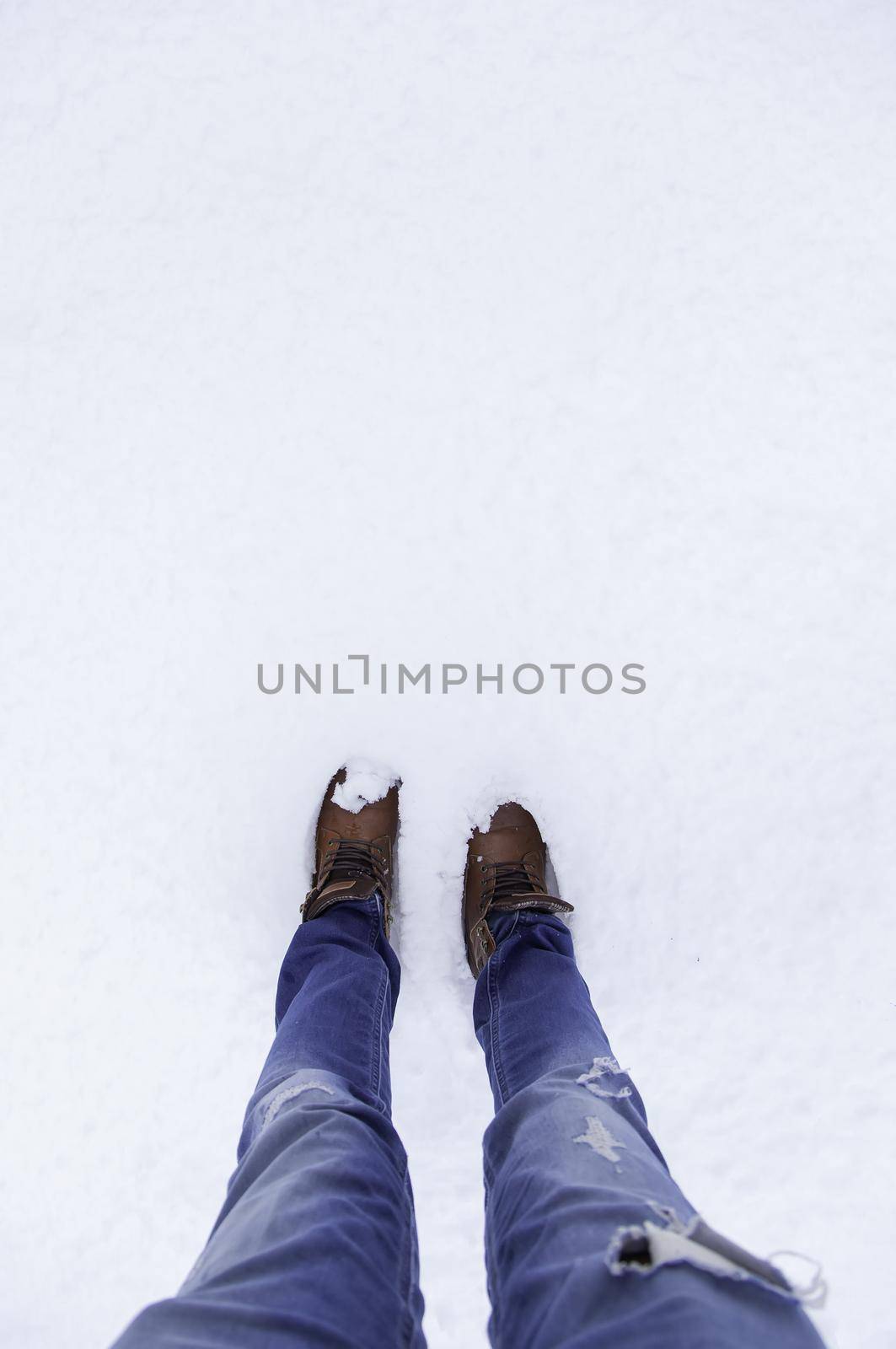 Man's feet in snow by esebene