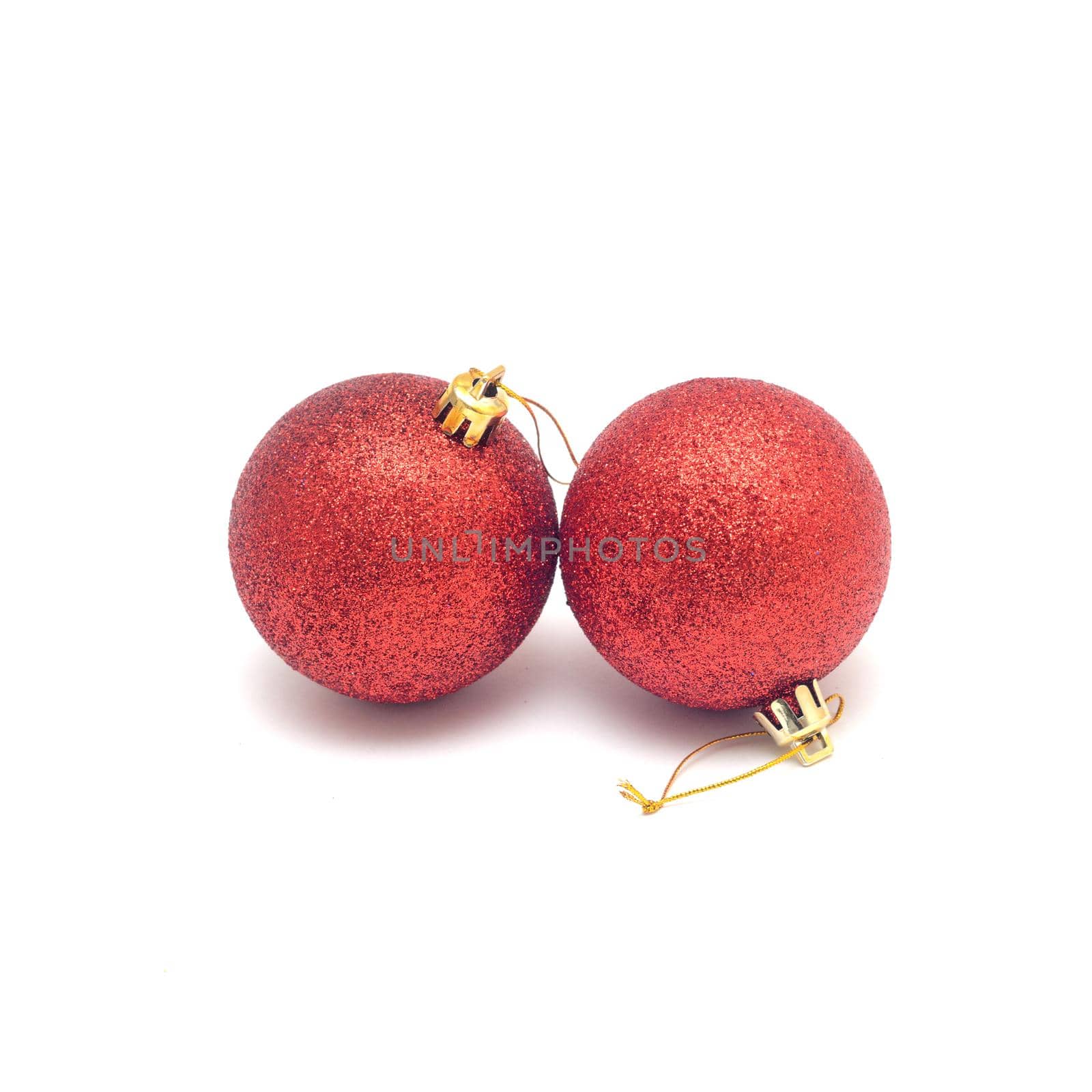Two red Christmas balls isolated on a white background. by andre_dechapelle