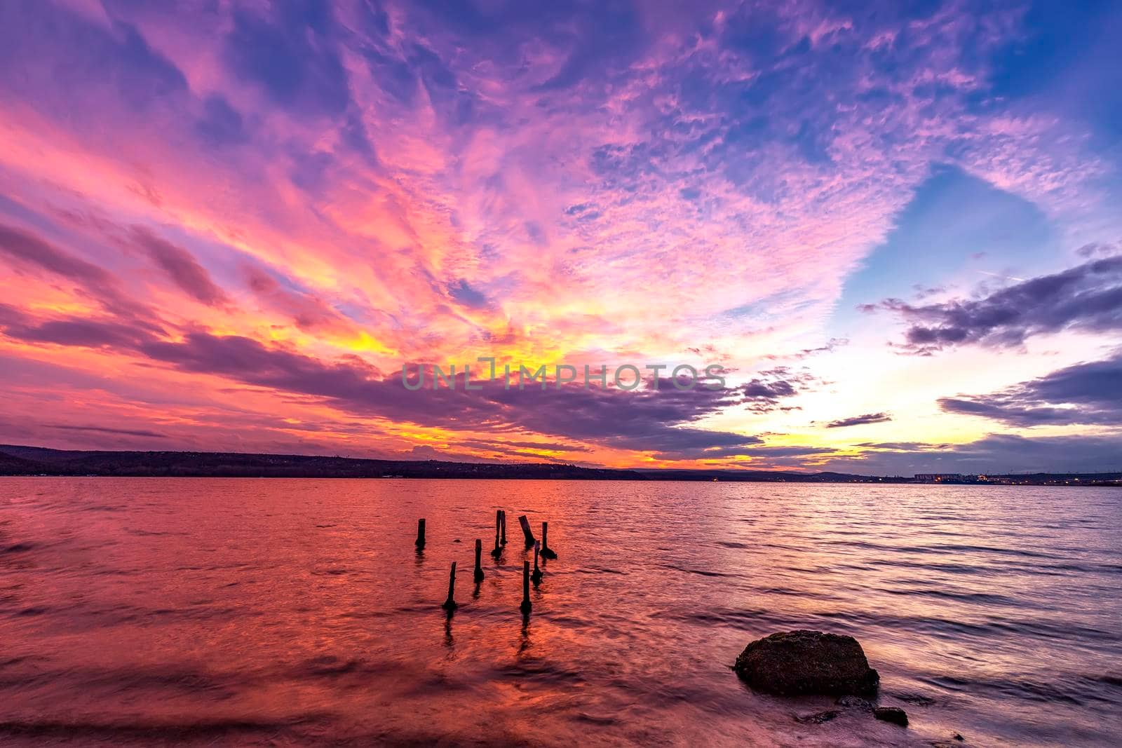 Dramatic colorful sunset at the seashore. Horizontal view