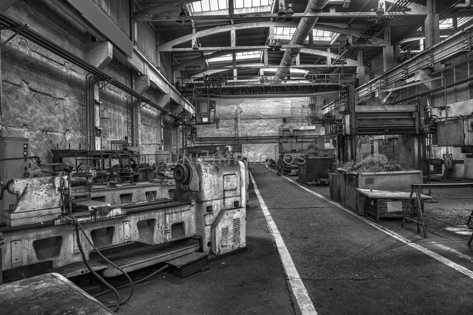 Factory with old industrial machinery.Black and white. Horizontal view