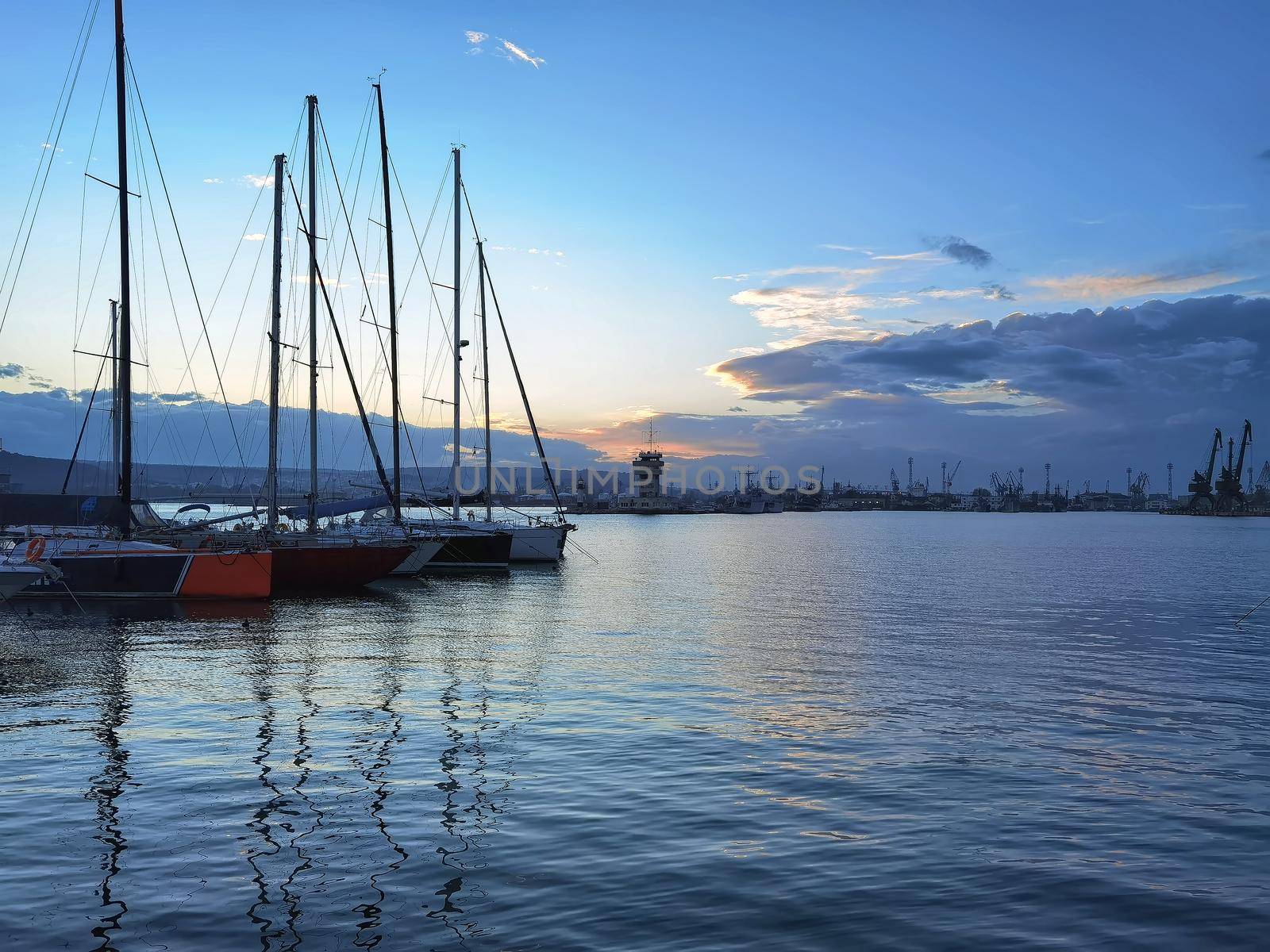 Yachts and boats at sunset in the harbor. Black sea, Varna, Bulgaria.