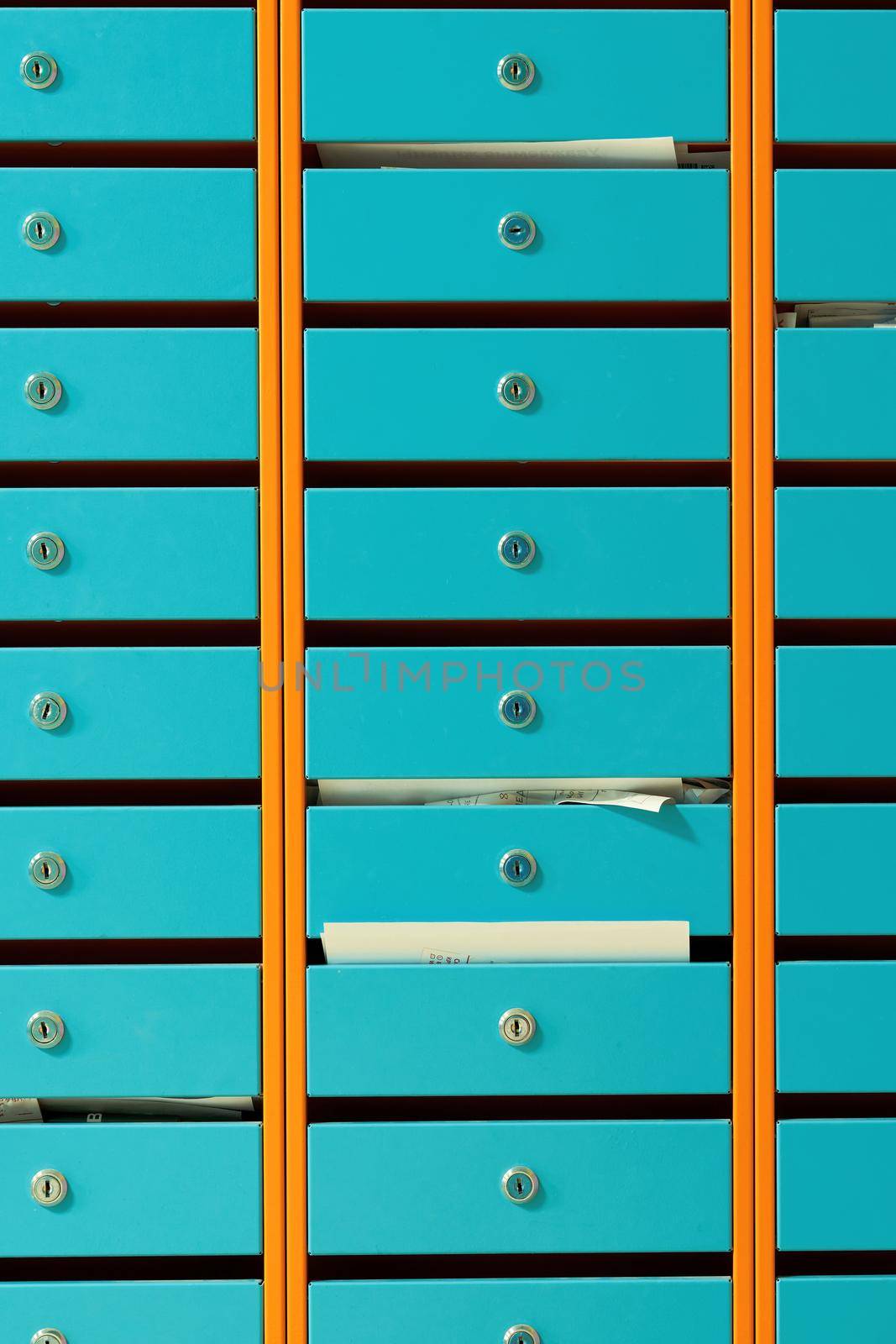 metal mailboxes in an apartment building, close up by vizland