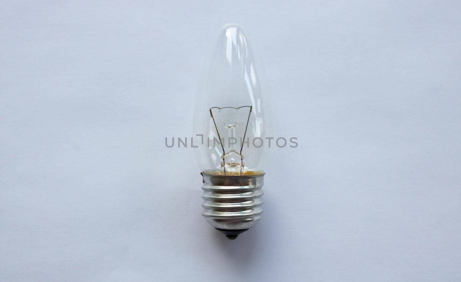 Small tungsten light bulb isolated on white background.