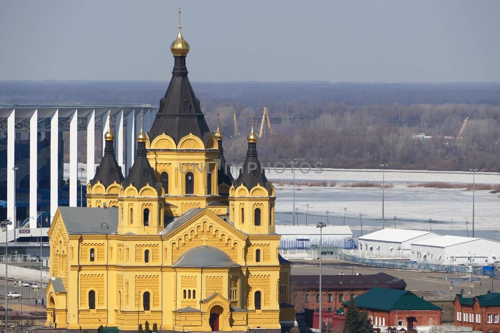  Beautiful Orthodox church made of yellow brick on the river bank. Alexander Nevsky Cathedral on in Nizhny Novgorod, Russia by Olga26