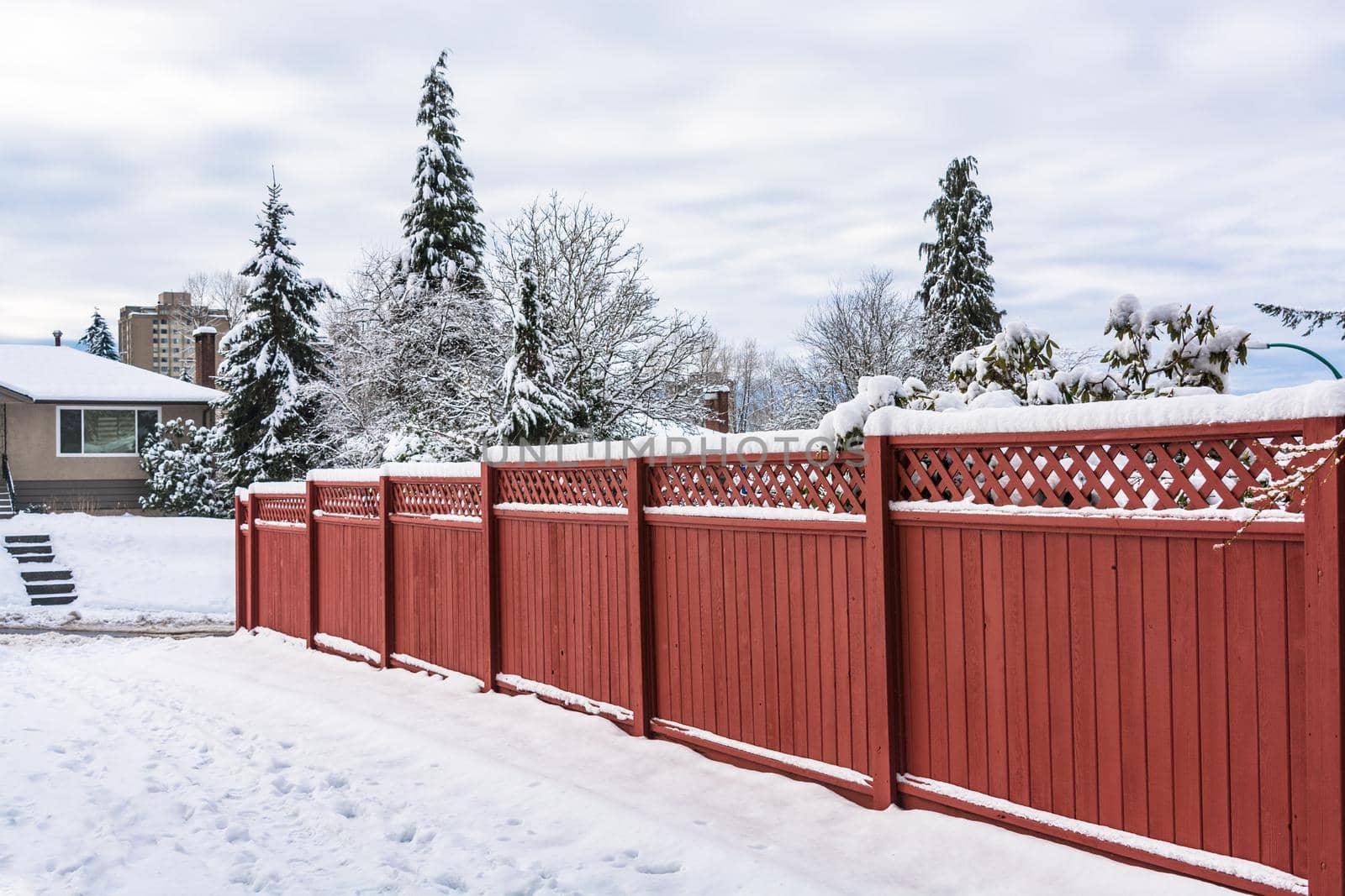 Wooden fence along a road on winter season in Vancouver, Canada.