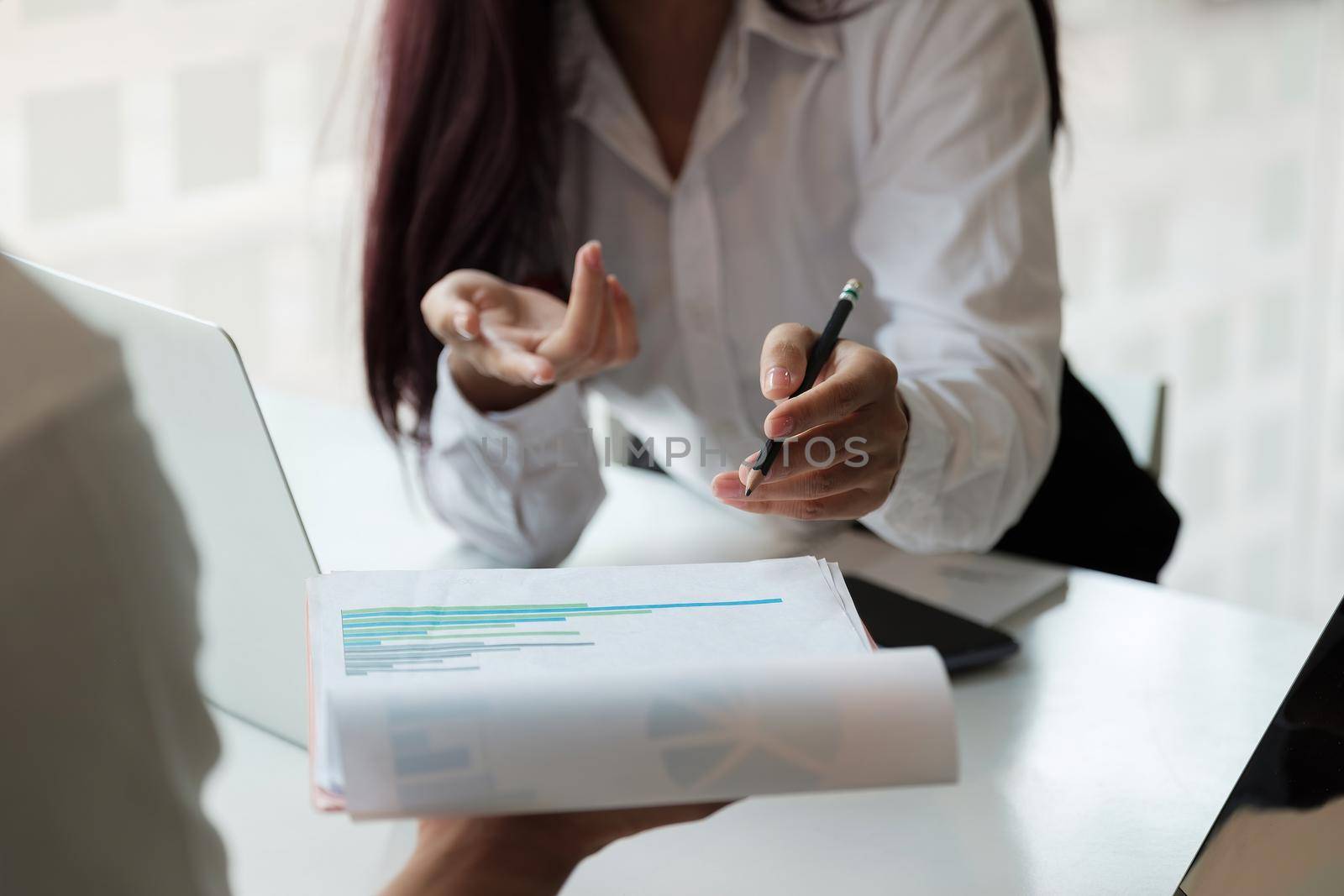 Close up business adviser meeting to analyze and discuss the situation on the financial report in the meeting room.Investment Consultant,Financial Consultant,Financial advisor and accounting concept