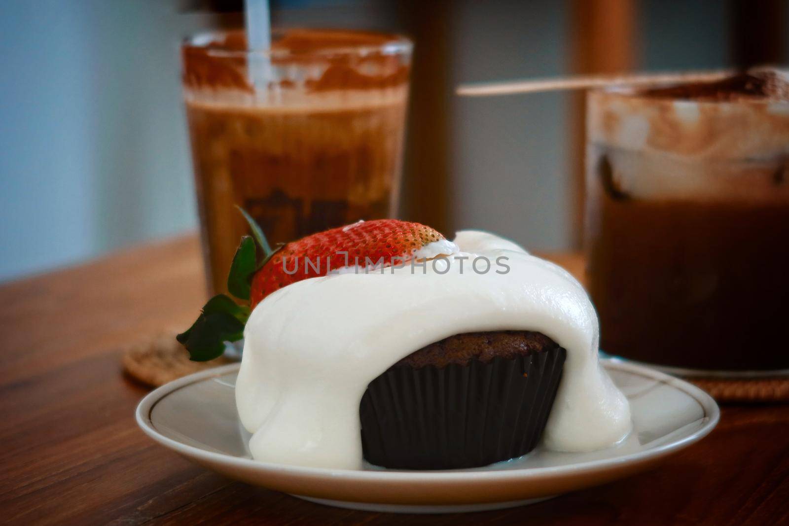 closeup chocolate cake with milk foam and strawberry