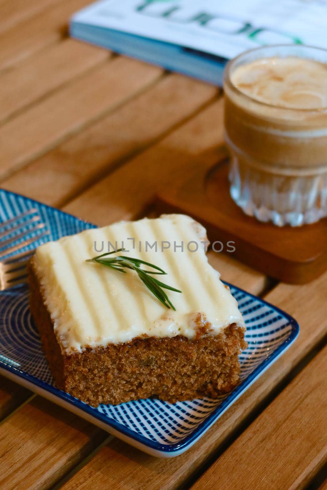 closeup carrot cake with iced coffee background by baworn47