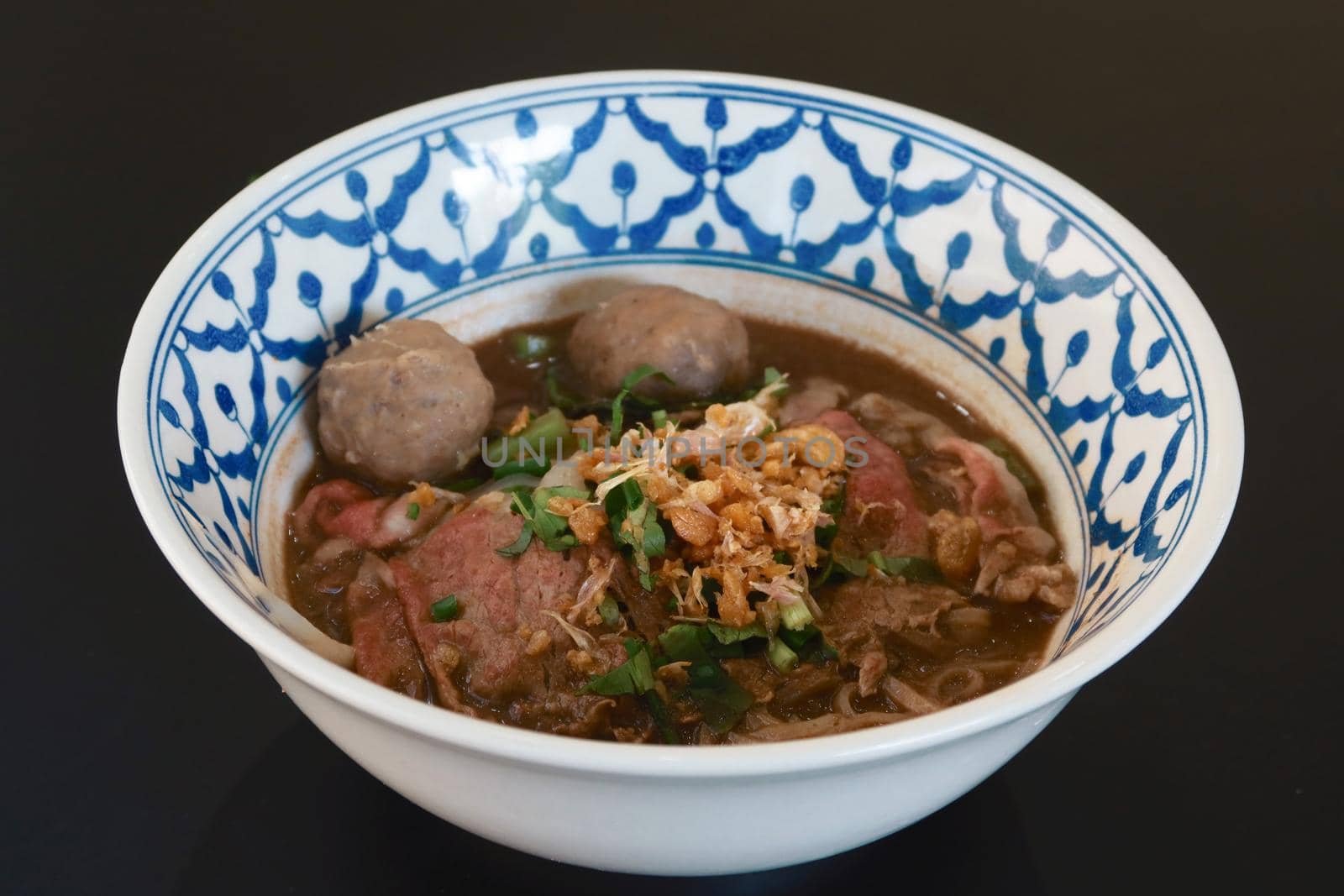 closeup stew beef noodle in thai style