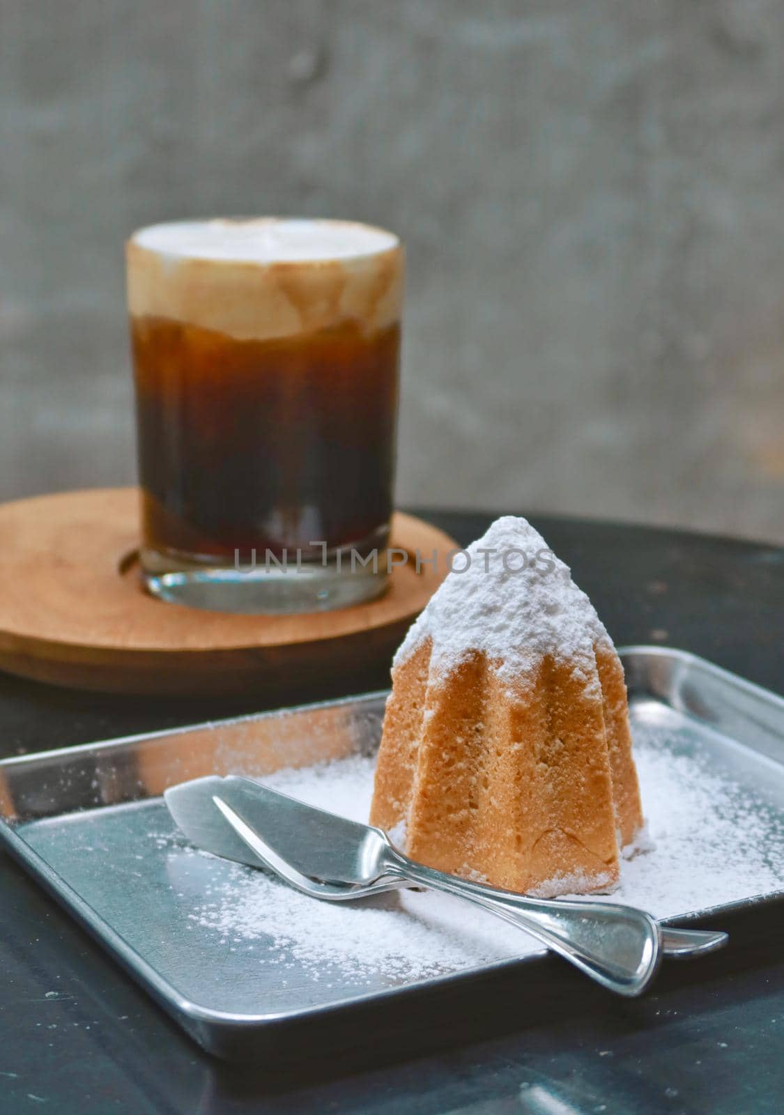 closeup doropan bread with sugar icing and black coffee background