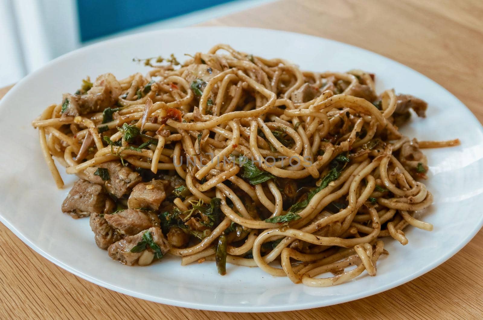 spaghetti pork with basil and herb