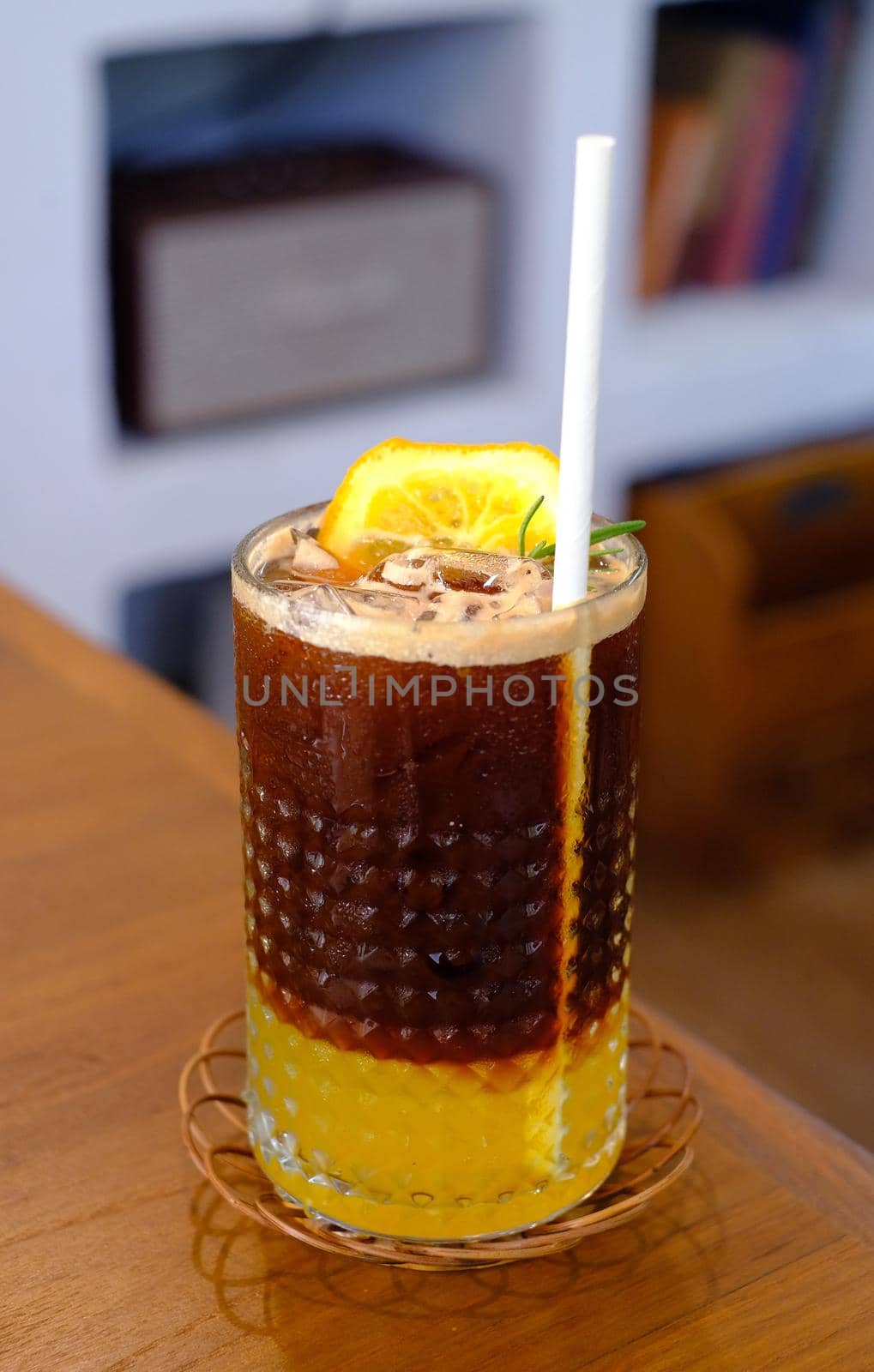 iced americano yuzu coffee on wood table