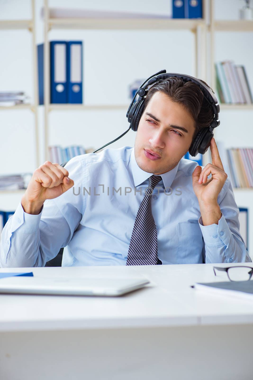 Sales assistant listening to music during lunch break