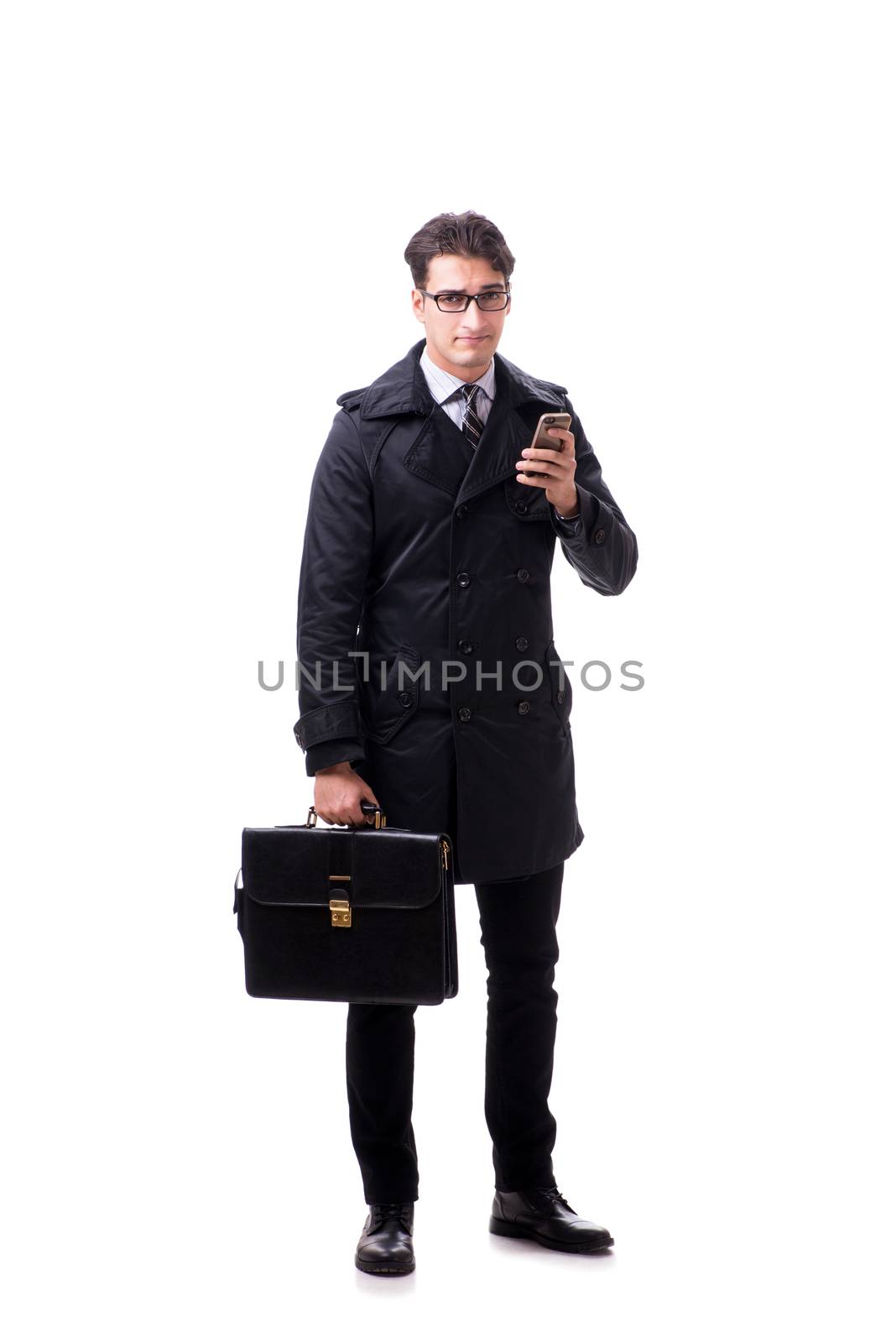 Young businessman wearing winter coat isolated on white