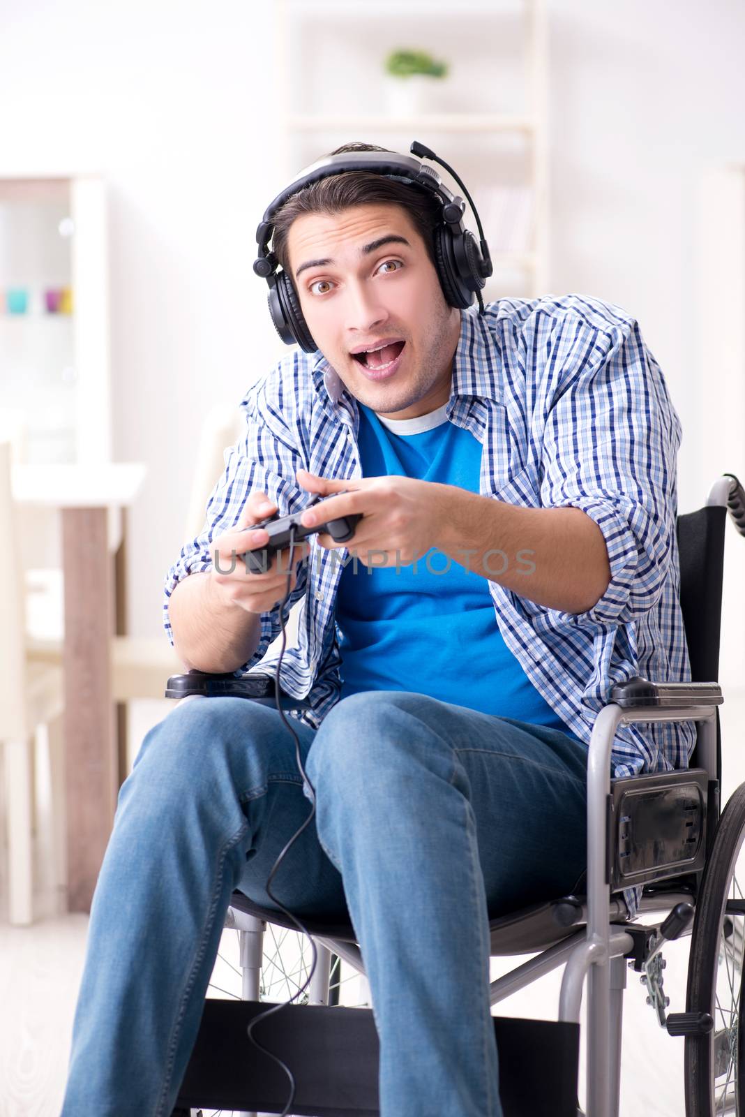 Disabled man playing computer games during rehabilitation