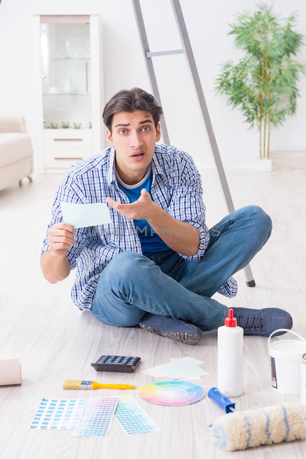 Young man overspending his budget in refurbishment project