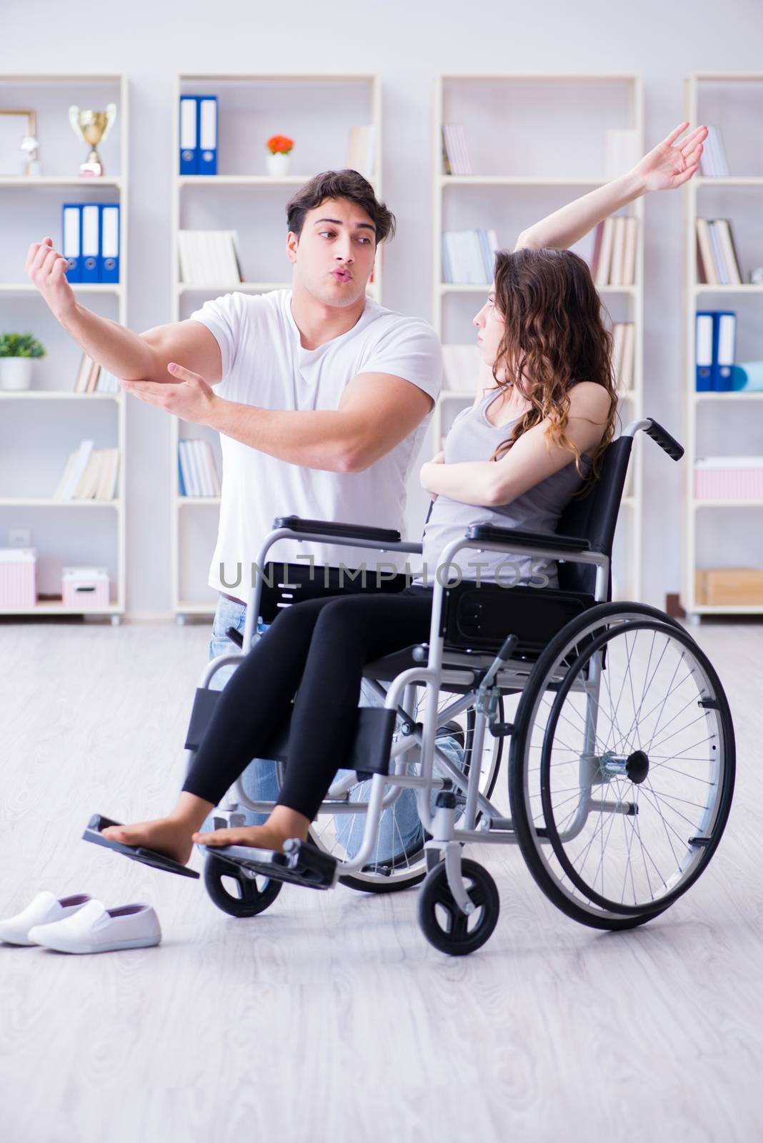 Patient undergoing rehabilitation recovery programme with doctor