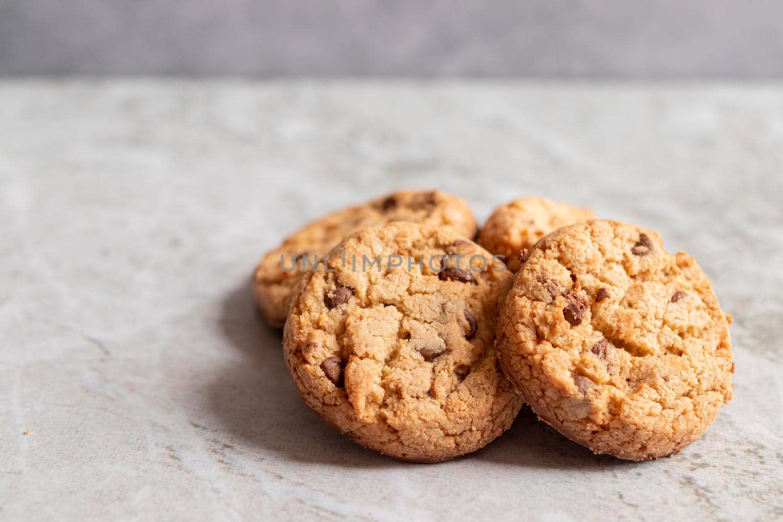 Freshly baked cookies placed on marbled texture