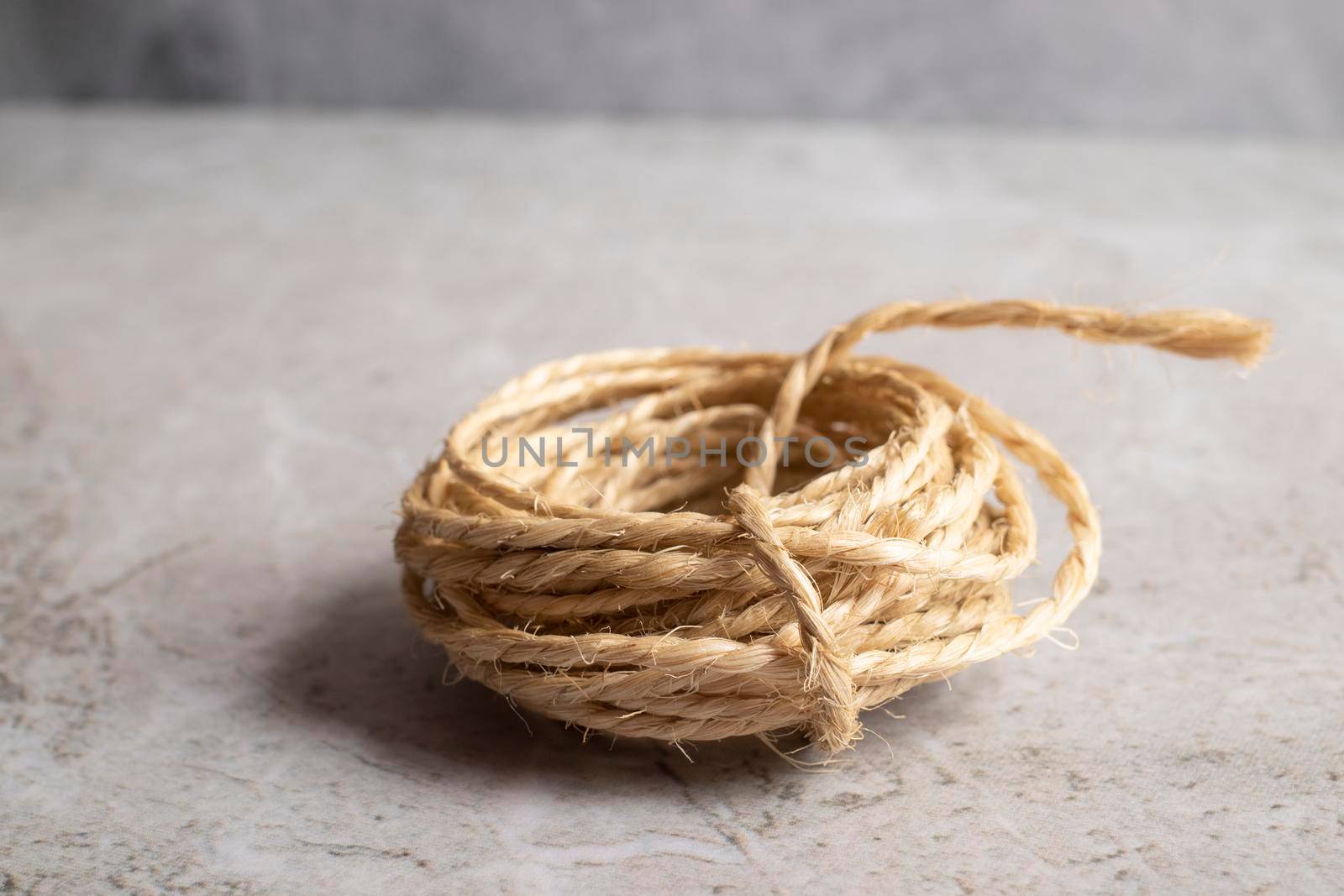 View of a roll of rope on a golden background by eagg13