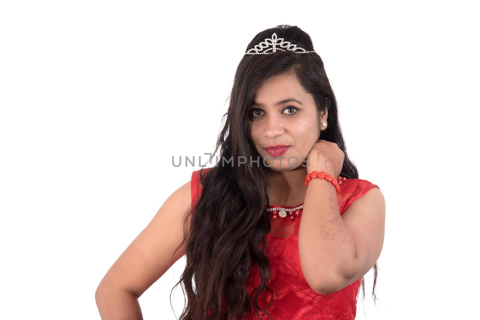 Young girl in red dress posing on white background by DipakShelare
