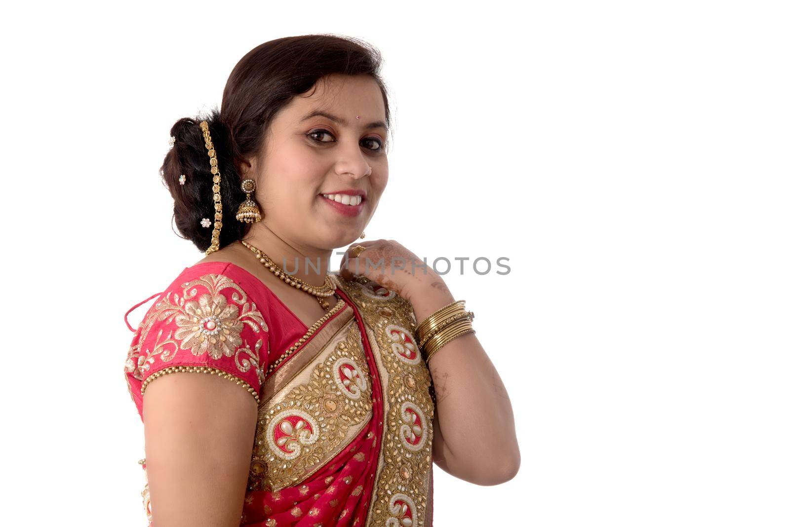 Beautiful young girl posing in Indian traditional saree on white background.