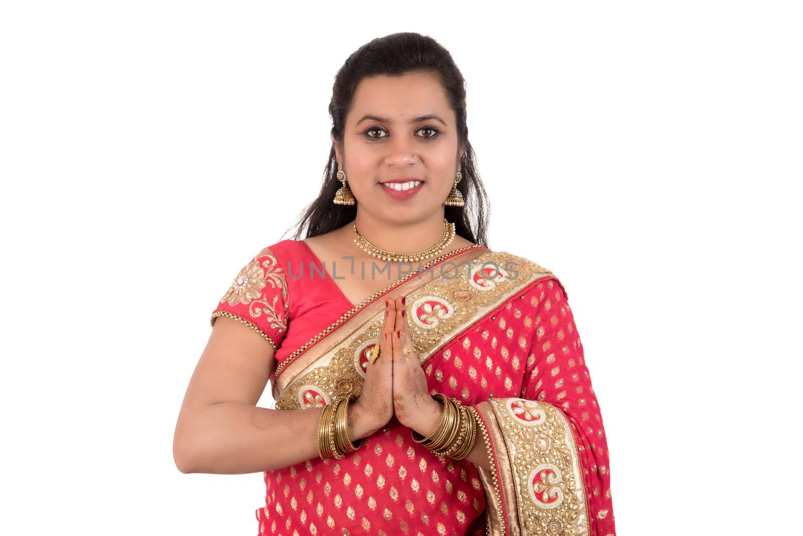 Beautiful Indian girl in a tradition sari with welcome expression (inviting), greeting Namaste by DipakShelare