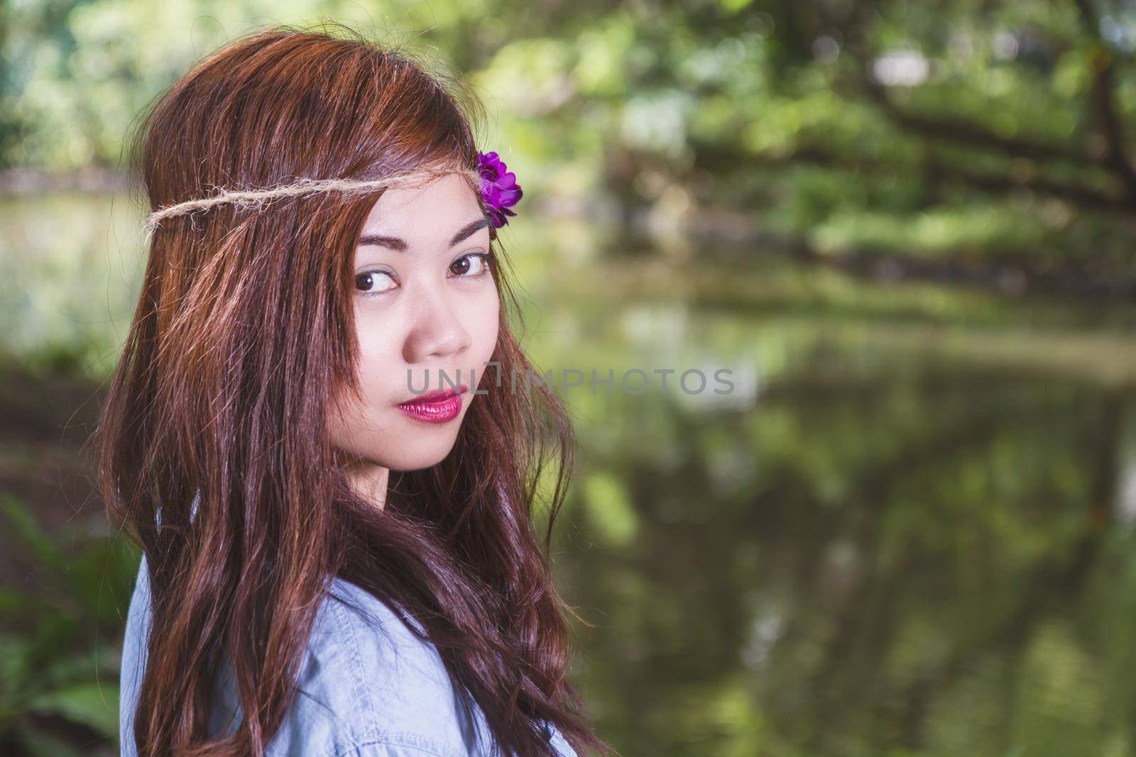 Filipina woman with a garden bokeh by imagesbykenny
