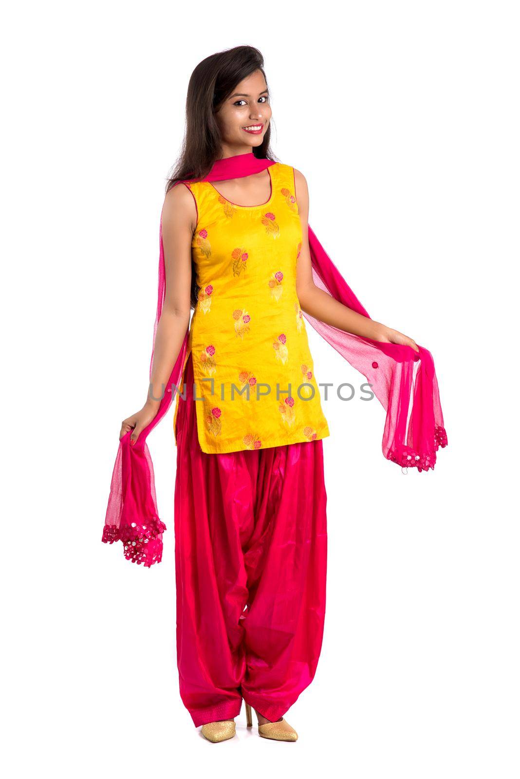 Beautiful Indian traditional girl posing on white background.