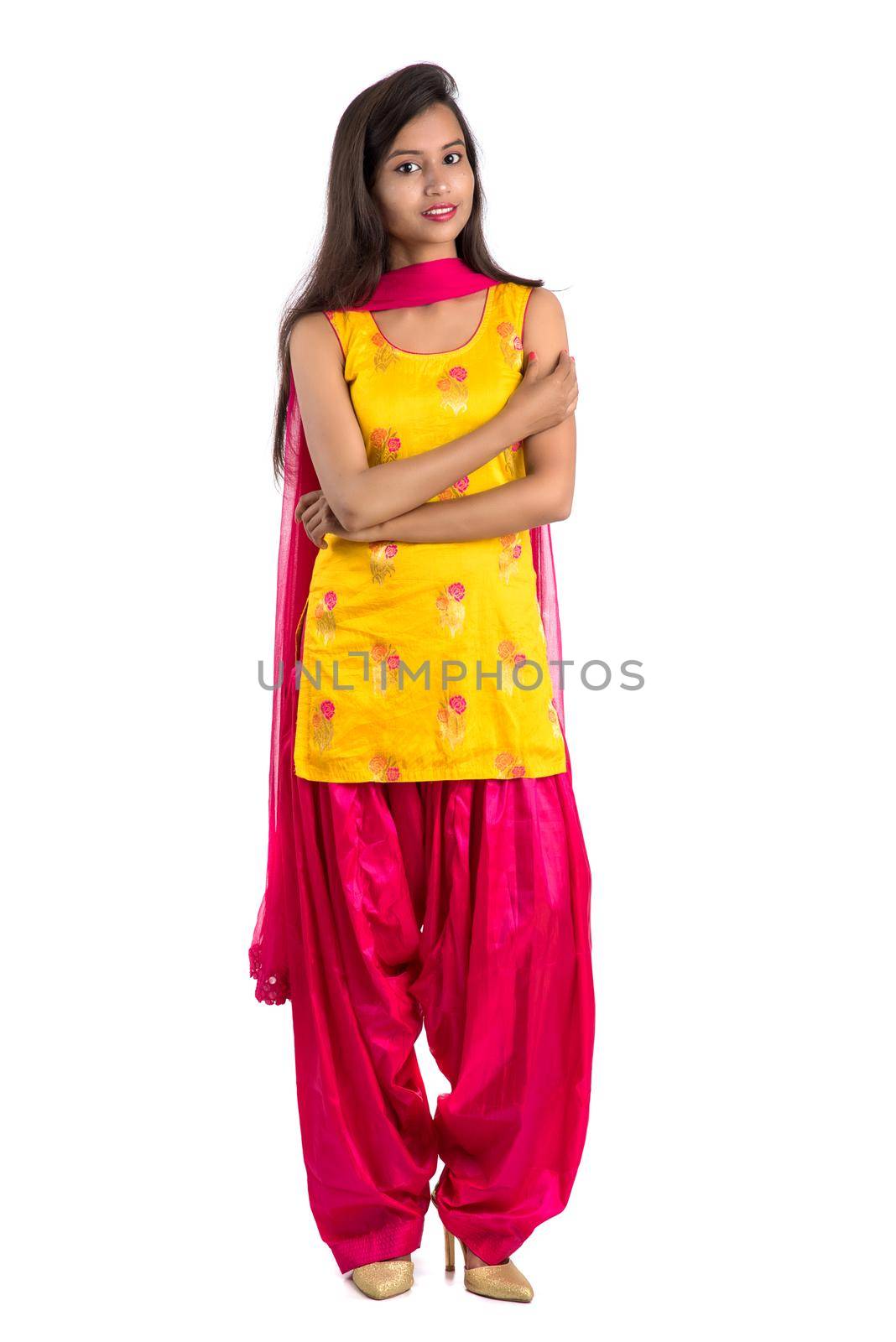 Beautiful Indian traditional girl posing on white background.