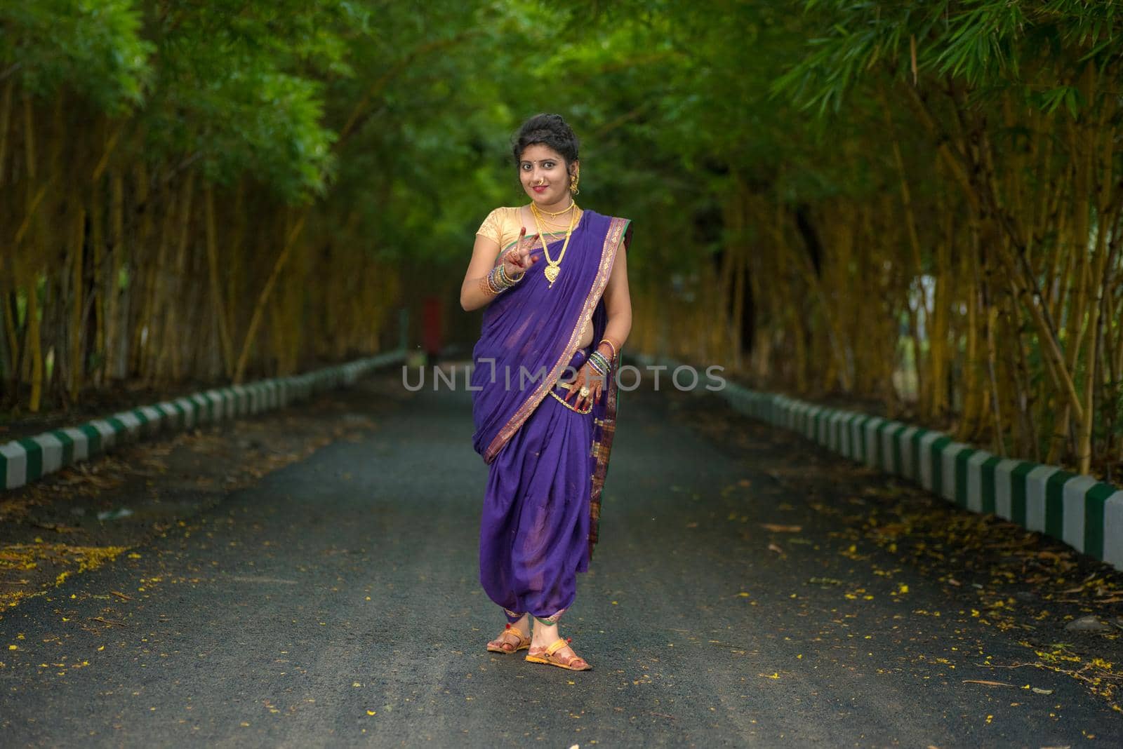 Indian Traditional Beautiful young girl in saree posing outdoors