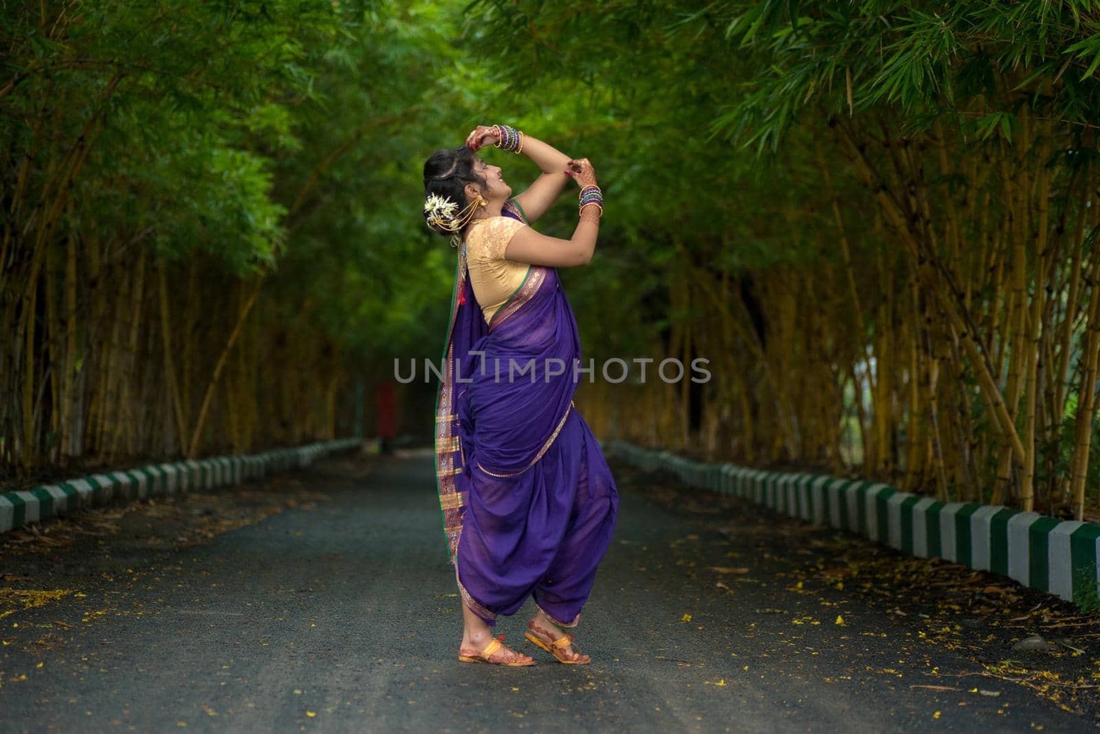 Indian Traditional Beautiful young girl in saree posing outdoors