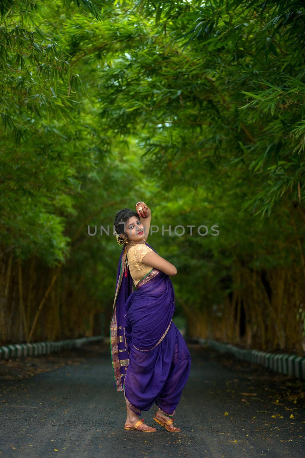 Indian Traditional Beautiful young girl in saree posing outdoors